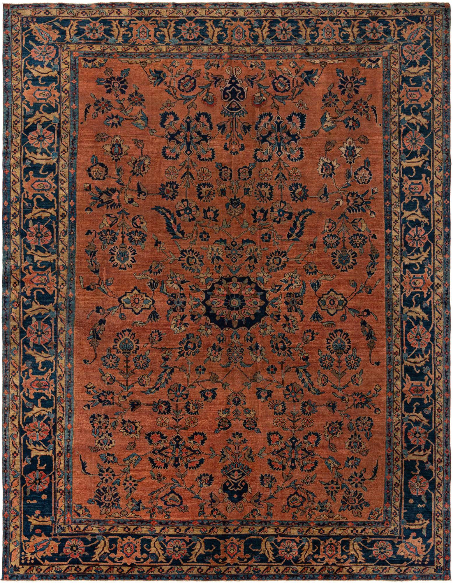 A 10x13 rectangular Sarough rug featuring a rich orange field with intricate dark blue and light blue botanical Persian patterns, ideal for a living room.