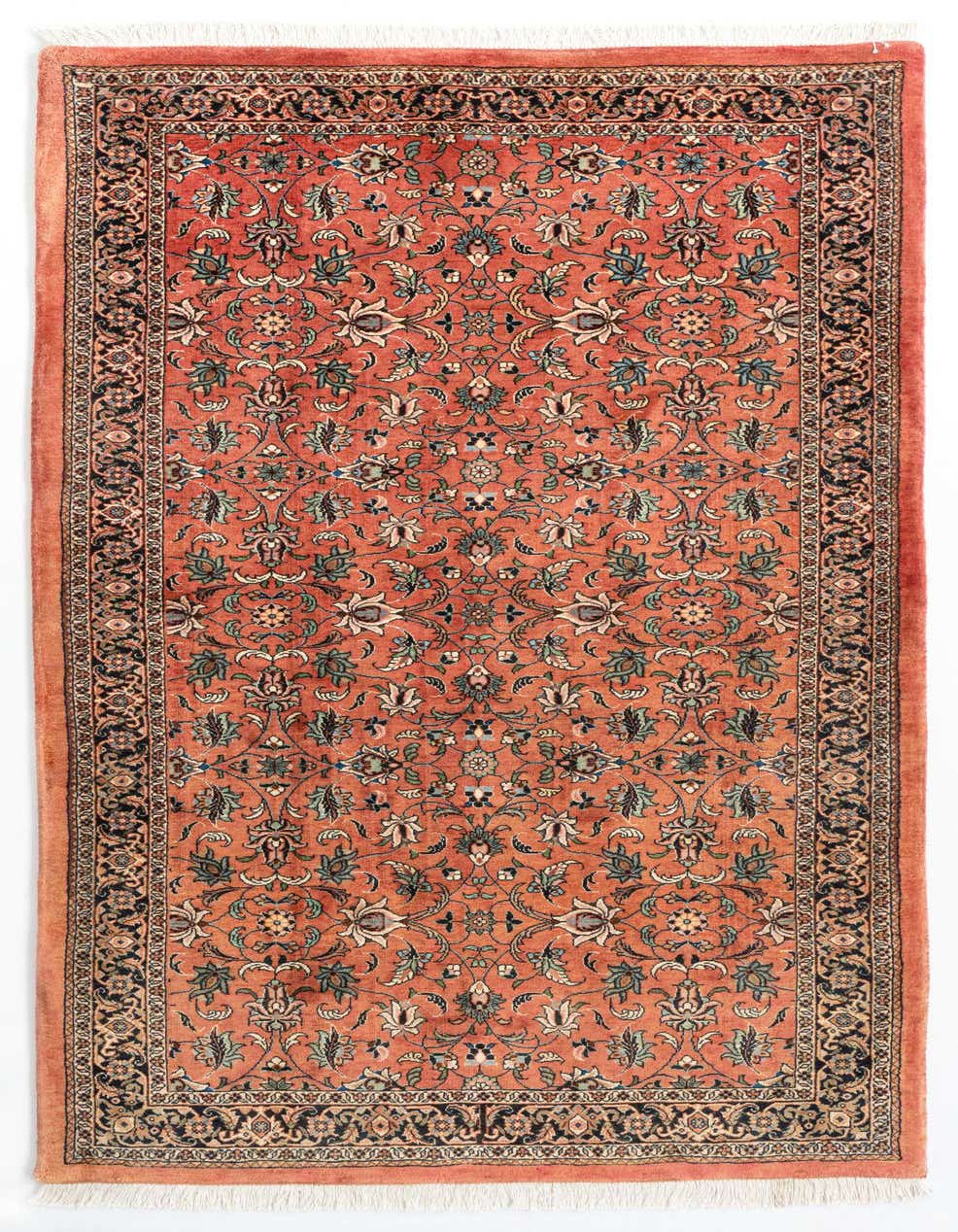 A 7 ft runner rug in a traditional Persian style, featuring an orange field with intricate floral patterns and a dark border.