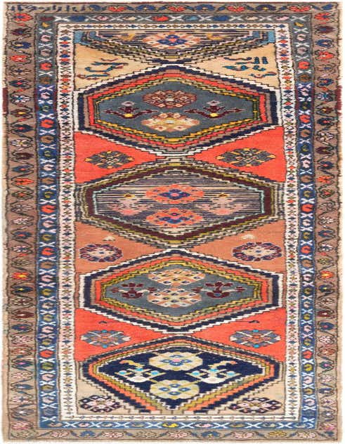 A 10 ft Hamedan runner rug in oranges, blues, and neutrals with a traditional tribal pattern, perfect for a hallway.