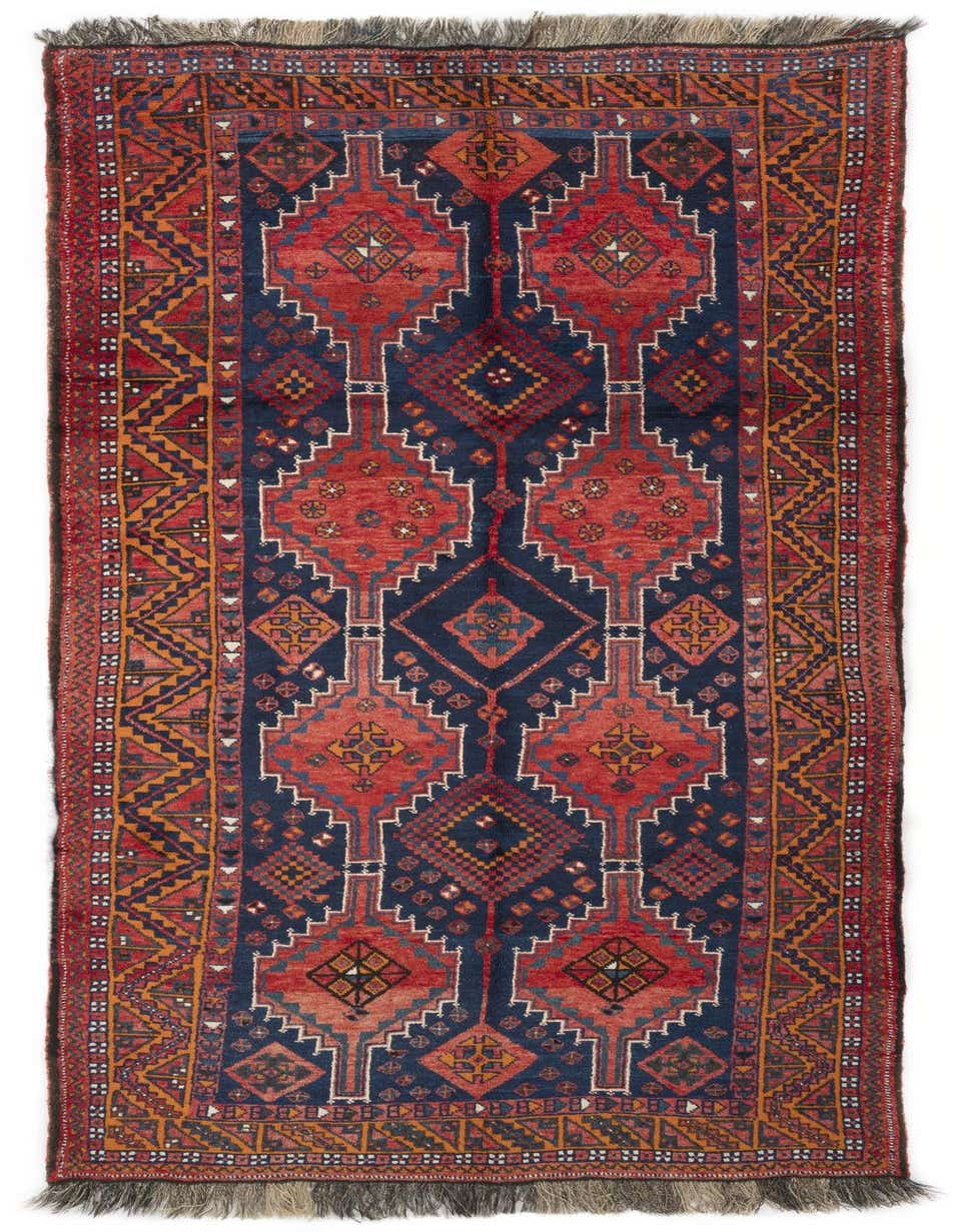 A 10 Ft Lori runner rug with a tribal Persian pattern in deep oranges, reds, and blues, featuring geometric motifs and fringe.