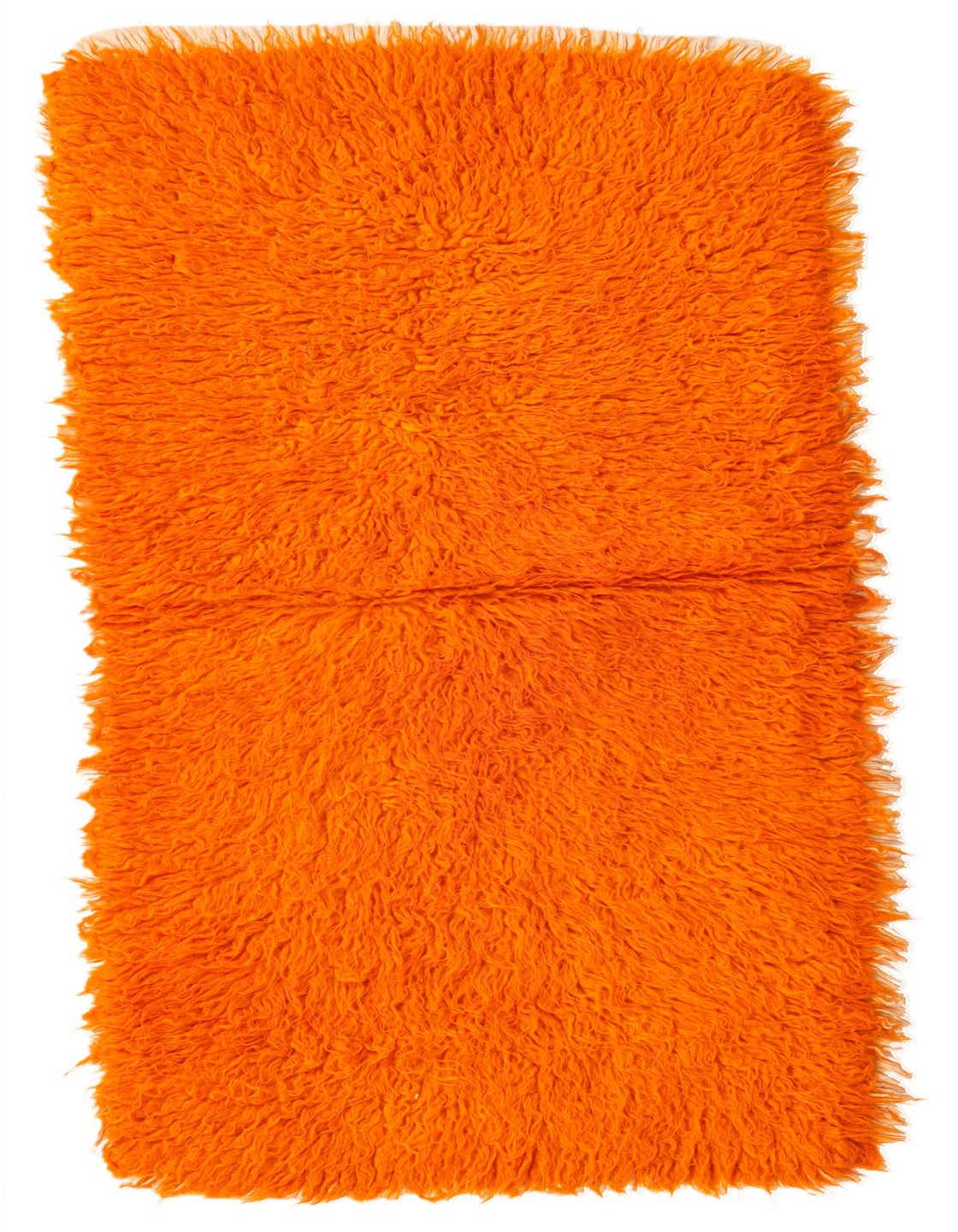 A vibrant orange 5 ft runner rug with a thick shag pile, handmade from wool, perfect for a hallway.