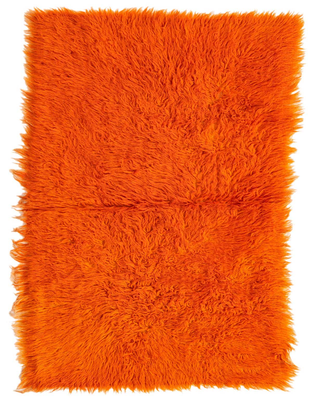 A vibrant orange 4 ft runner rug with a thick, shaggy pile, perfect for a hallway.