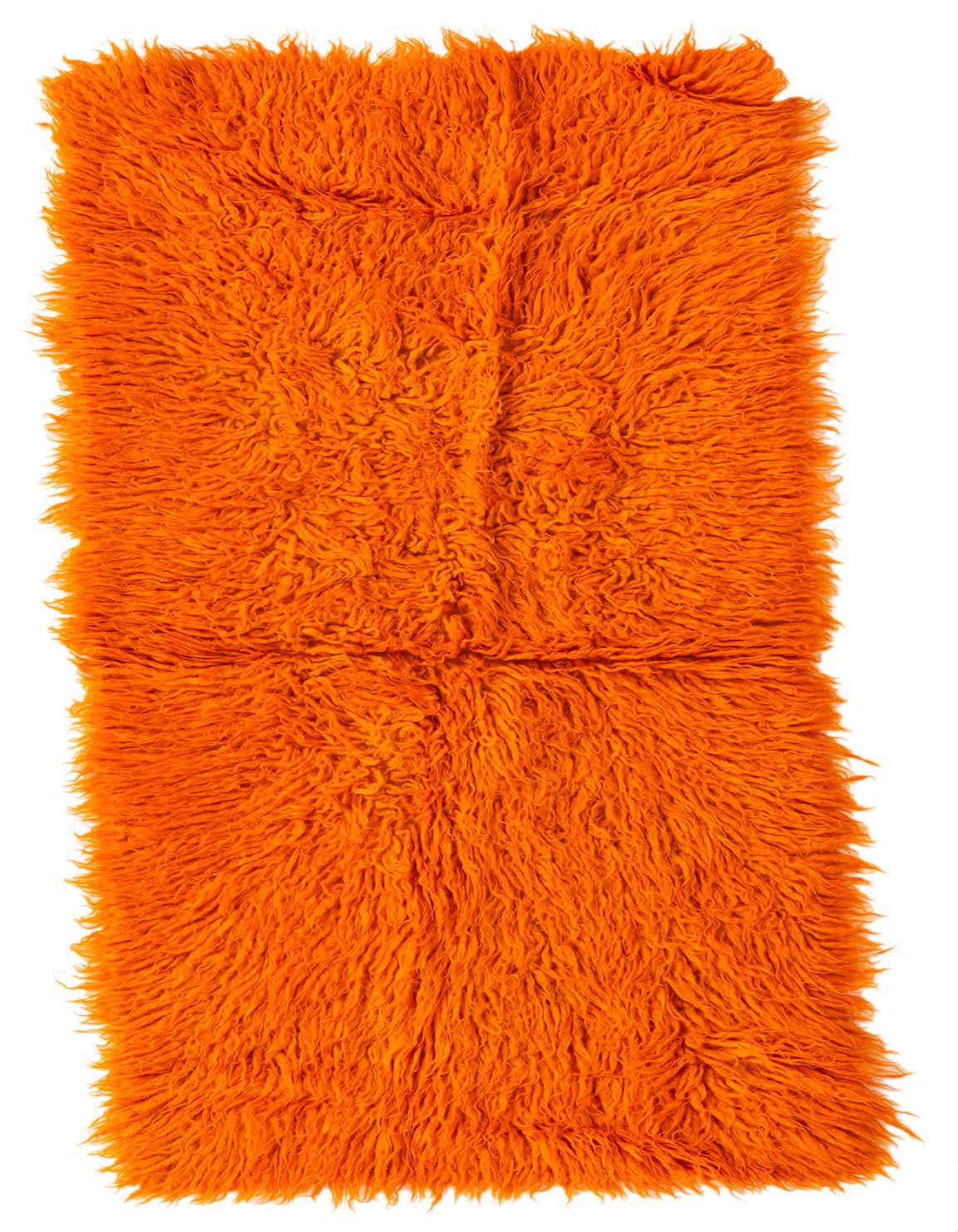 A vibrant orange 5 ft runner rug with a plush shag pile, handmade from wool, ideal for a hallway.