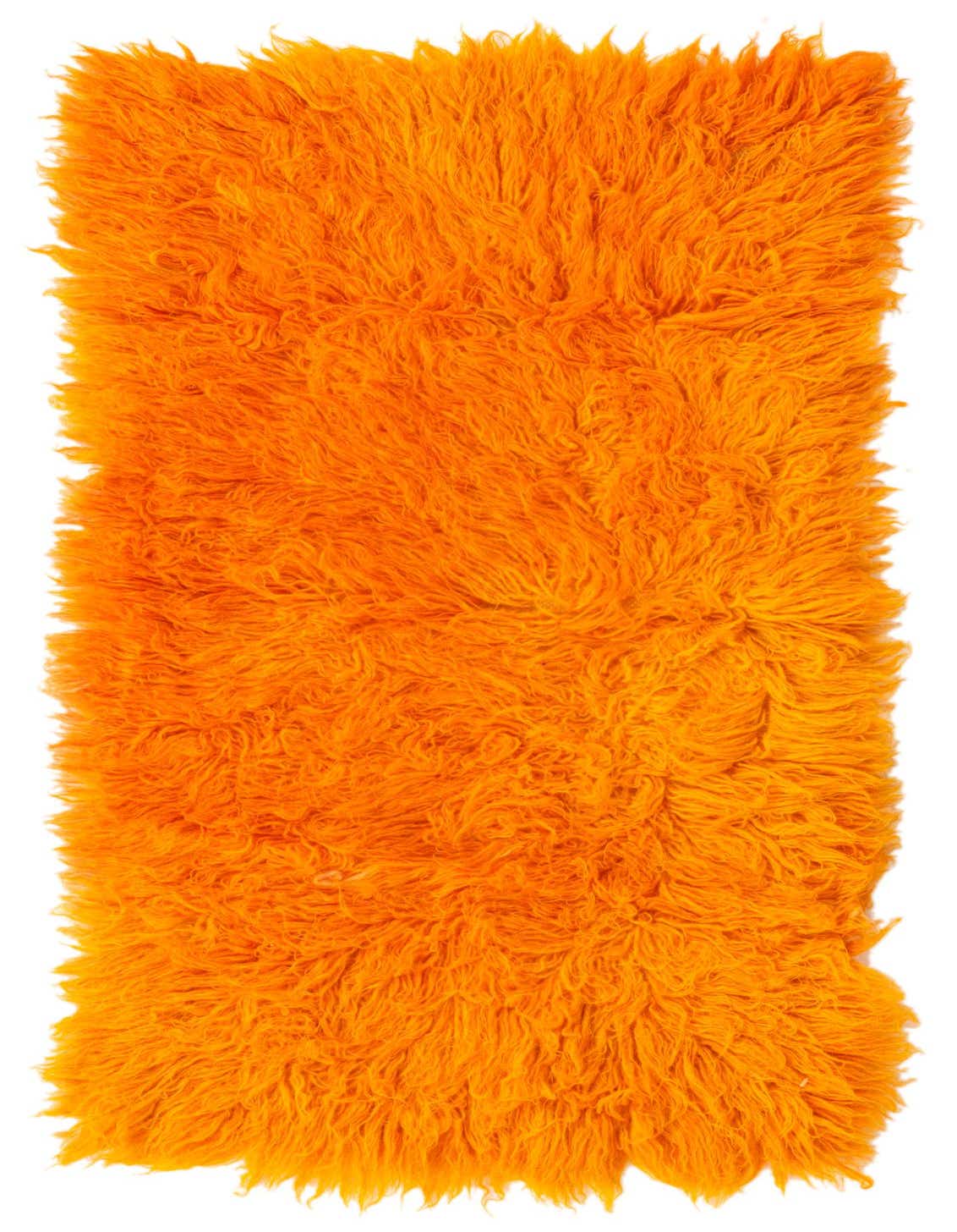 A vibrant orange shag runner rug, handmade from wool, with a plush, textured pile, perfect for a hallway.