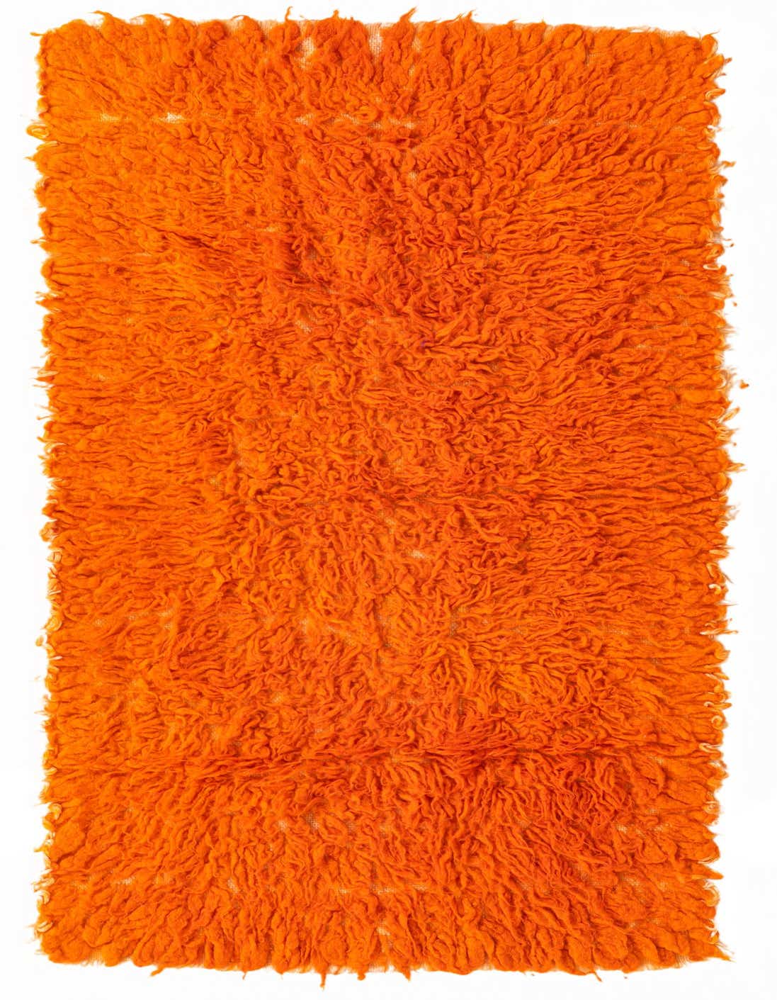 A vibrant orange 4 ft shag runner rug, handmade from wool, perfect for adding warmth to a hallway.