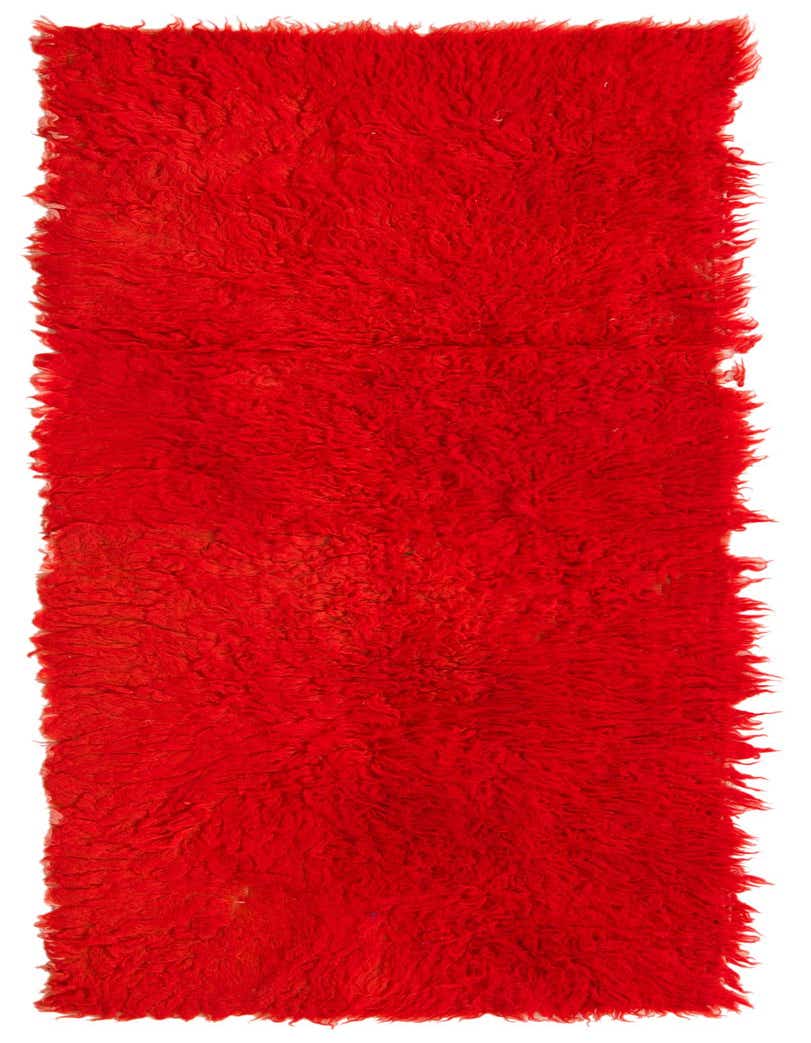 A vibrant 6 ft runner rug in a rich orange color, featuring a plush shag pile and tribal style.