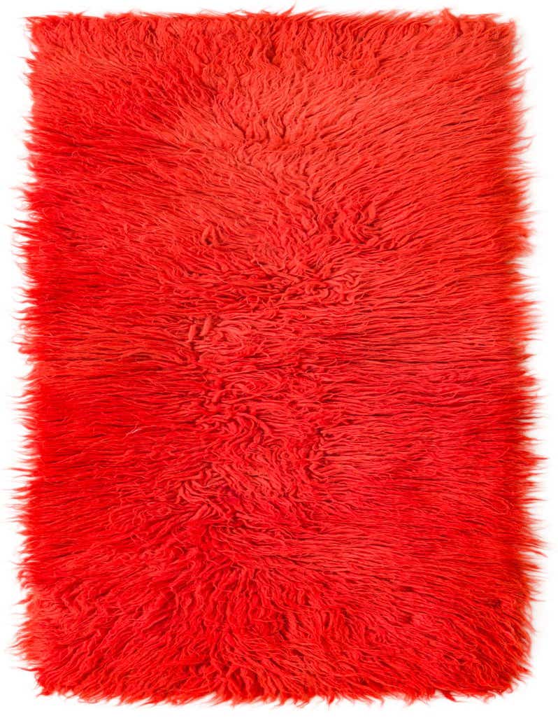 A vibrant orange 4 ft runner rug with a plush, shaggy texture, ideal for a hallway.