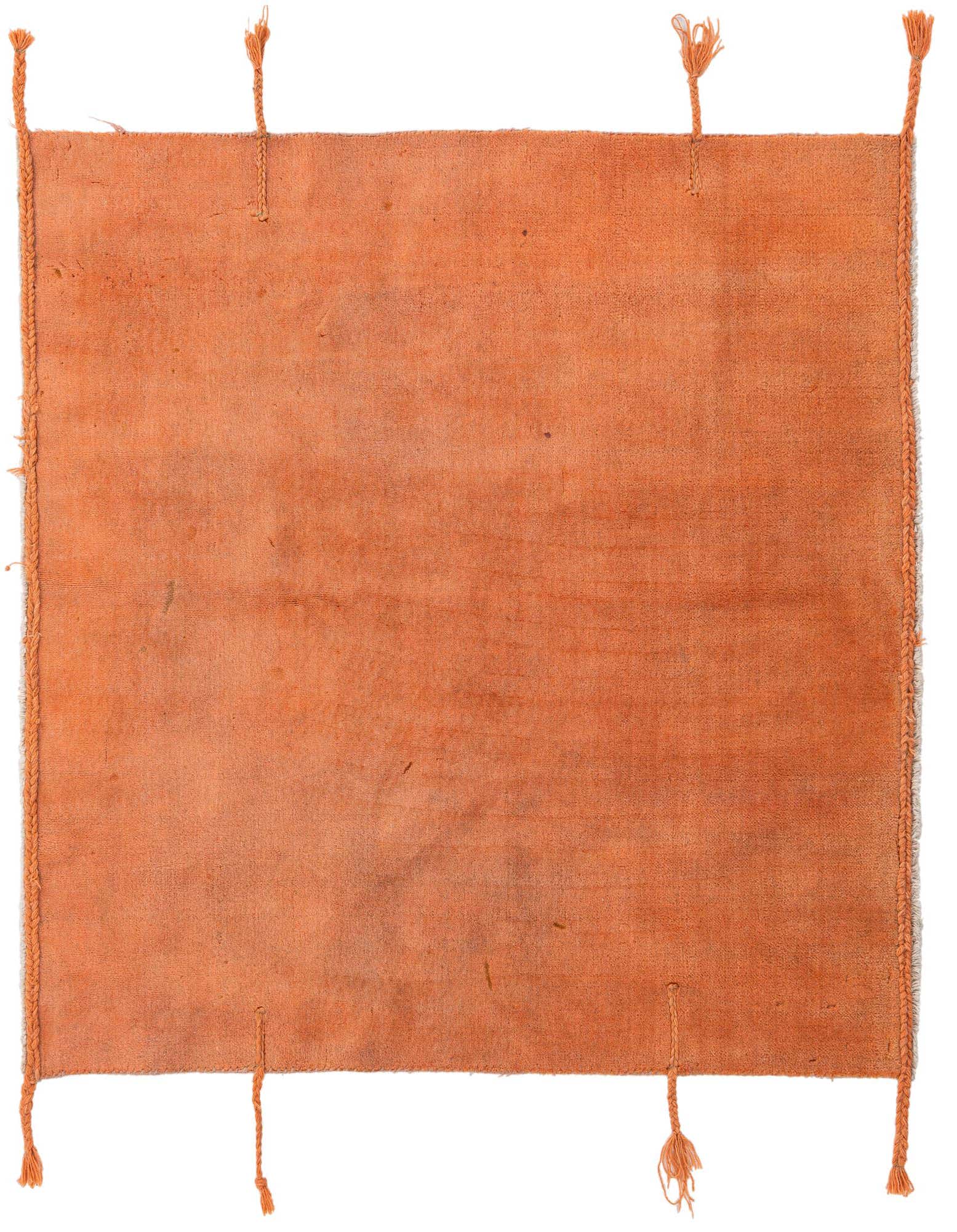 A handmade 4' 3 x 4' 7 square orange wool rug with a solid modern design and braided tassels.