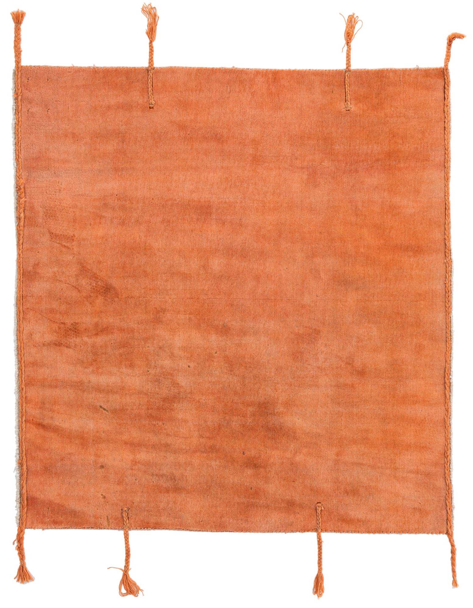A 4' 3 x 4' 7 square orange wool rug with a solid modern design and braided tassels at the corners and sides.