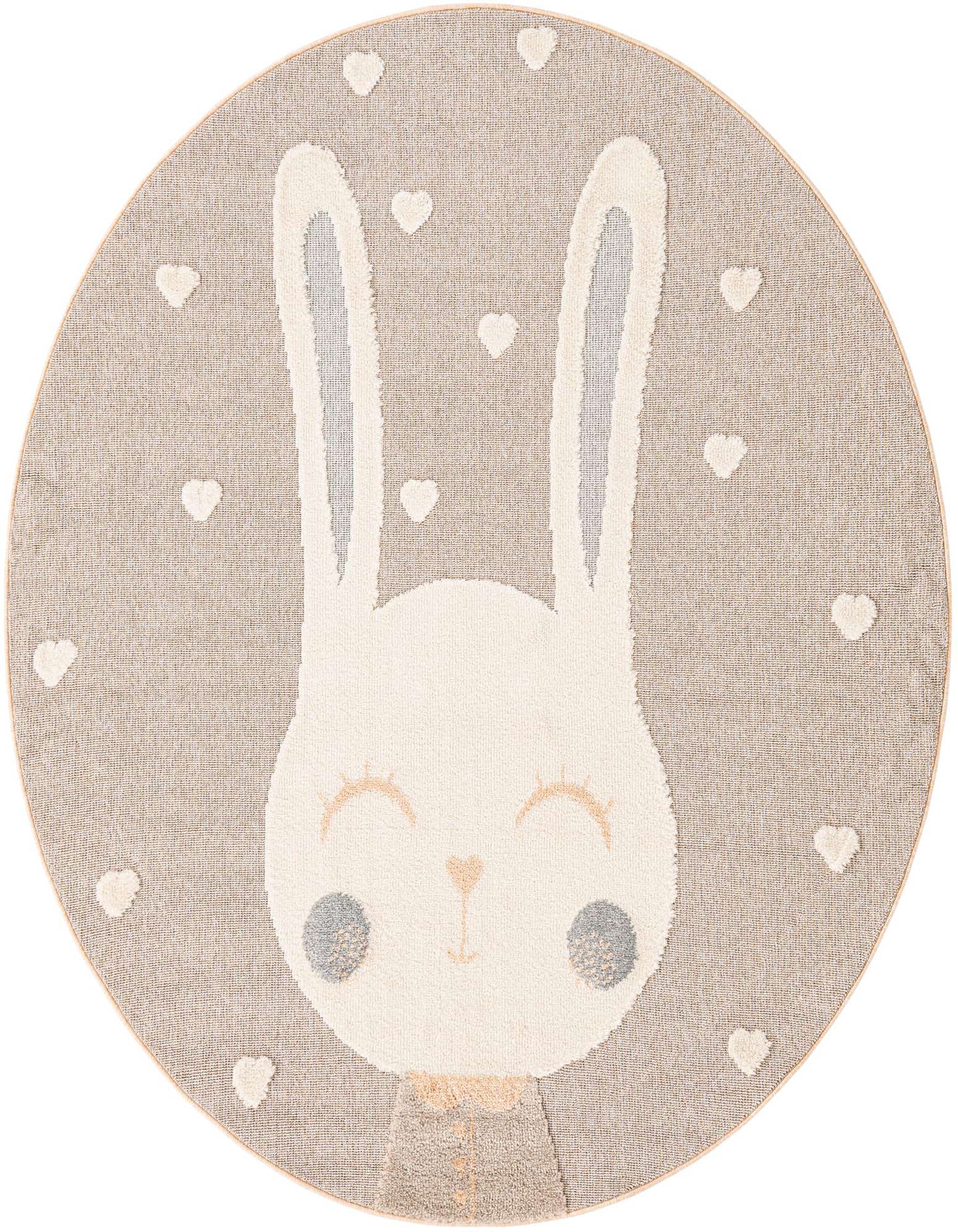 A round peach blossom rug featuring a large, friendly white bunny face with closed eyes and gray cheeks, surrounded by small white hearts.