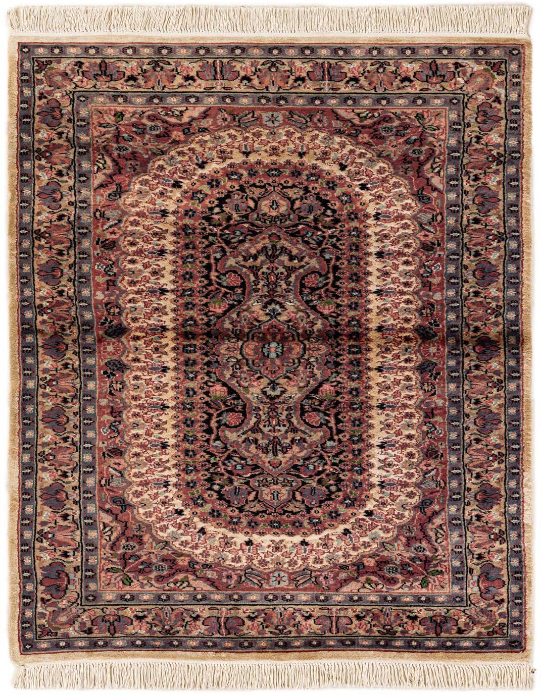 A 3x5 rectangular Bokhara rug featuring a central medallion and tribal patterns in rich oranges, creams, and blues, with fringe.
