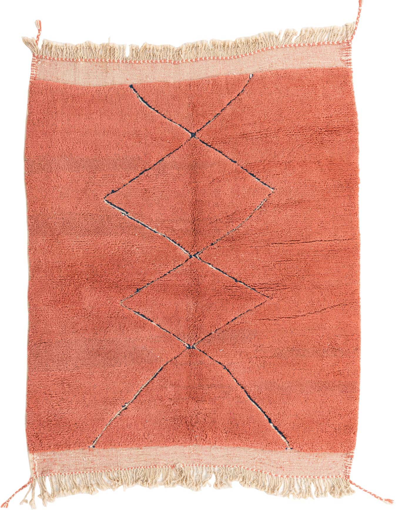 A 5x8 rectangular orange shag rug with a black tribal diamond pattern and cream fringe, perfect for a living room.