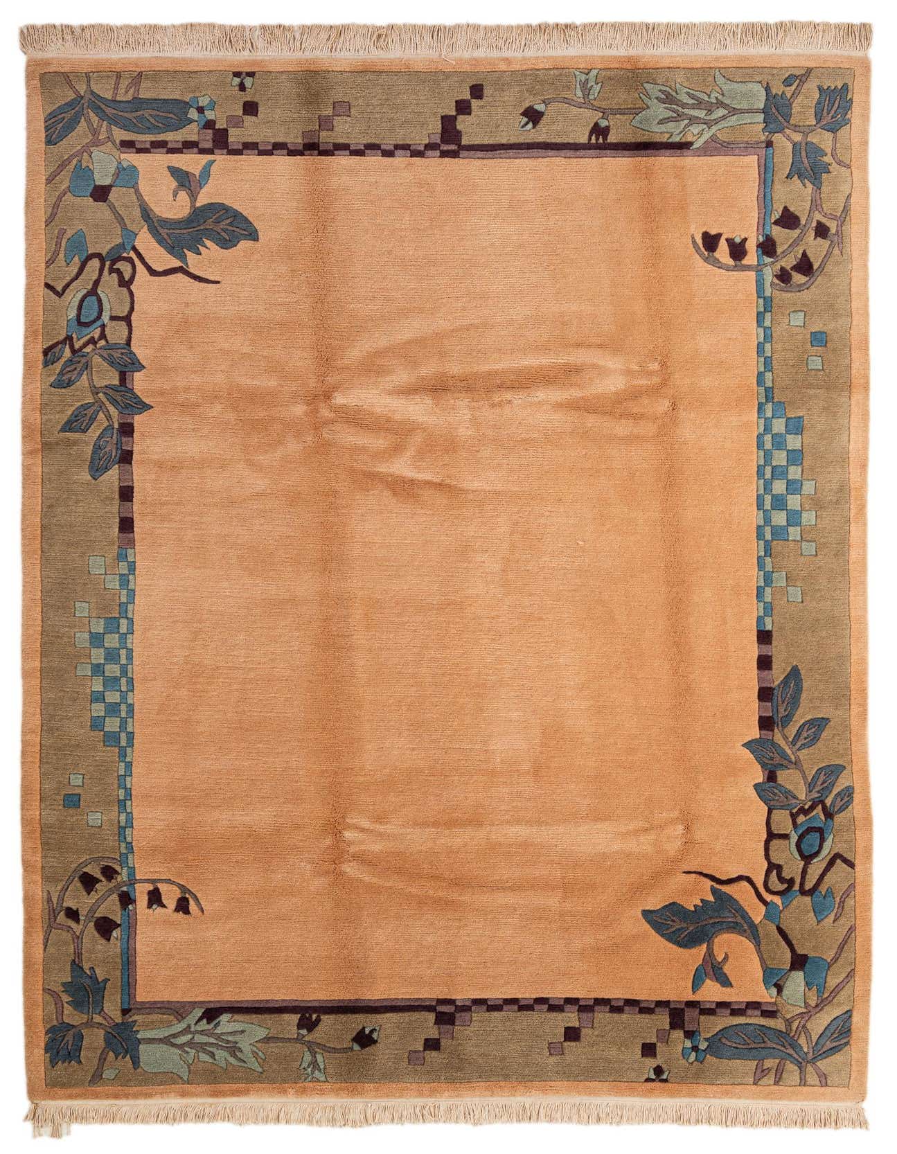 A 7x10 rectangular orange wool rug with a modern floral and geometric border in blue, green, and brown, suitable for a living room.