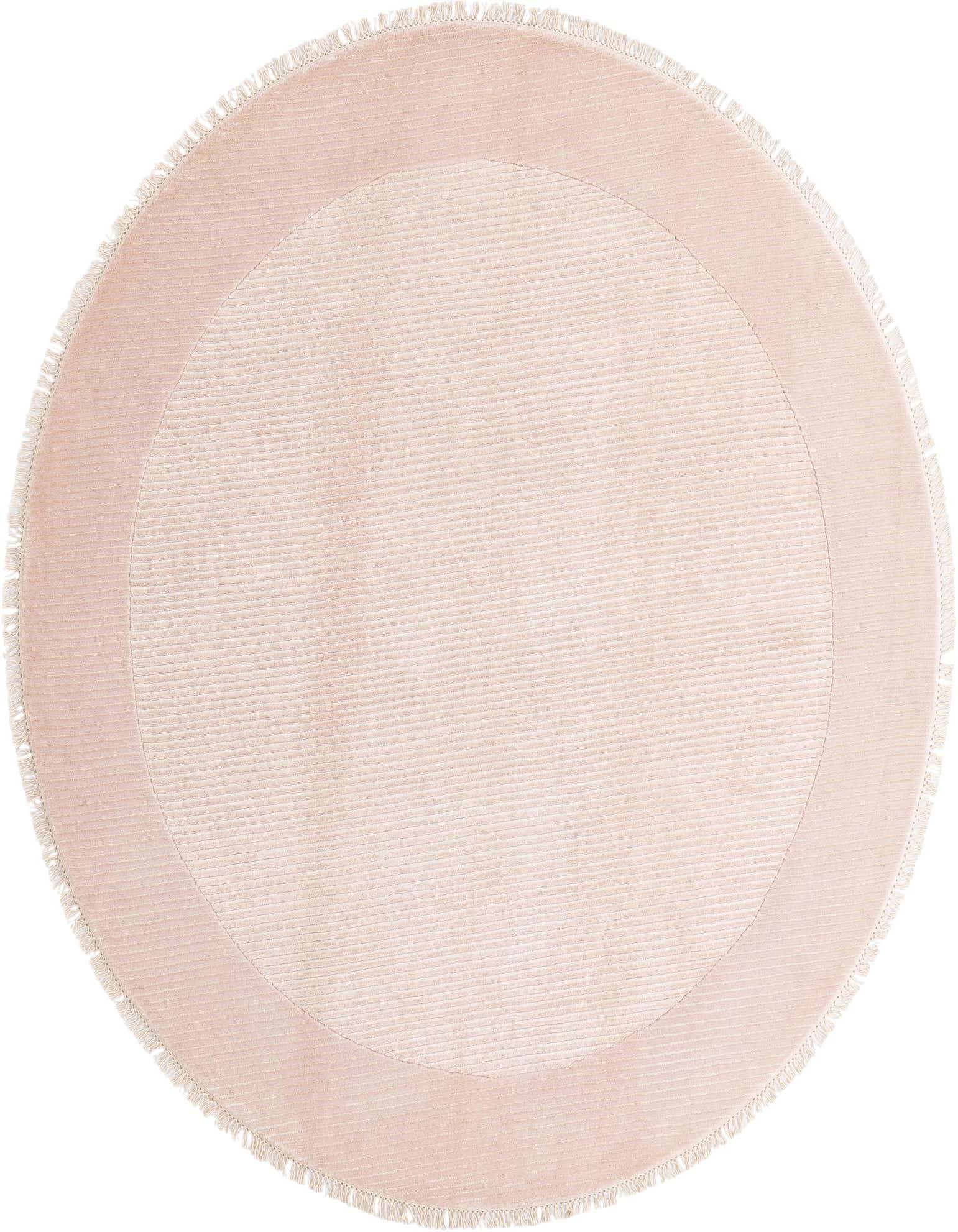 A 6' 6 round Darya rug in light orange, featuring a subtle striped pattern and a solid border with fringe.