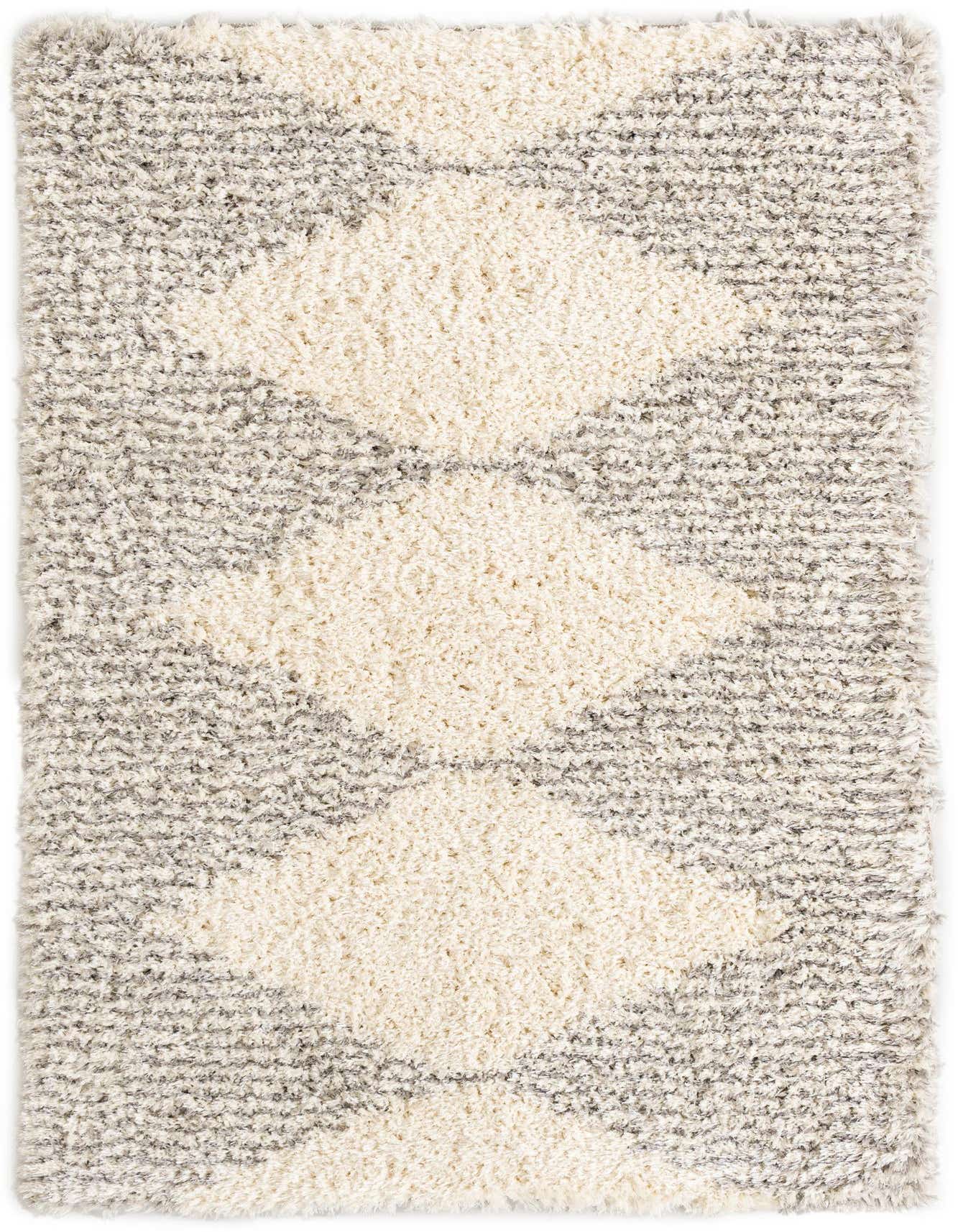A 5x8 rectangular gray and cream shag rug with a modern geometric pattern, ideal for a living room.