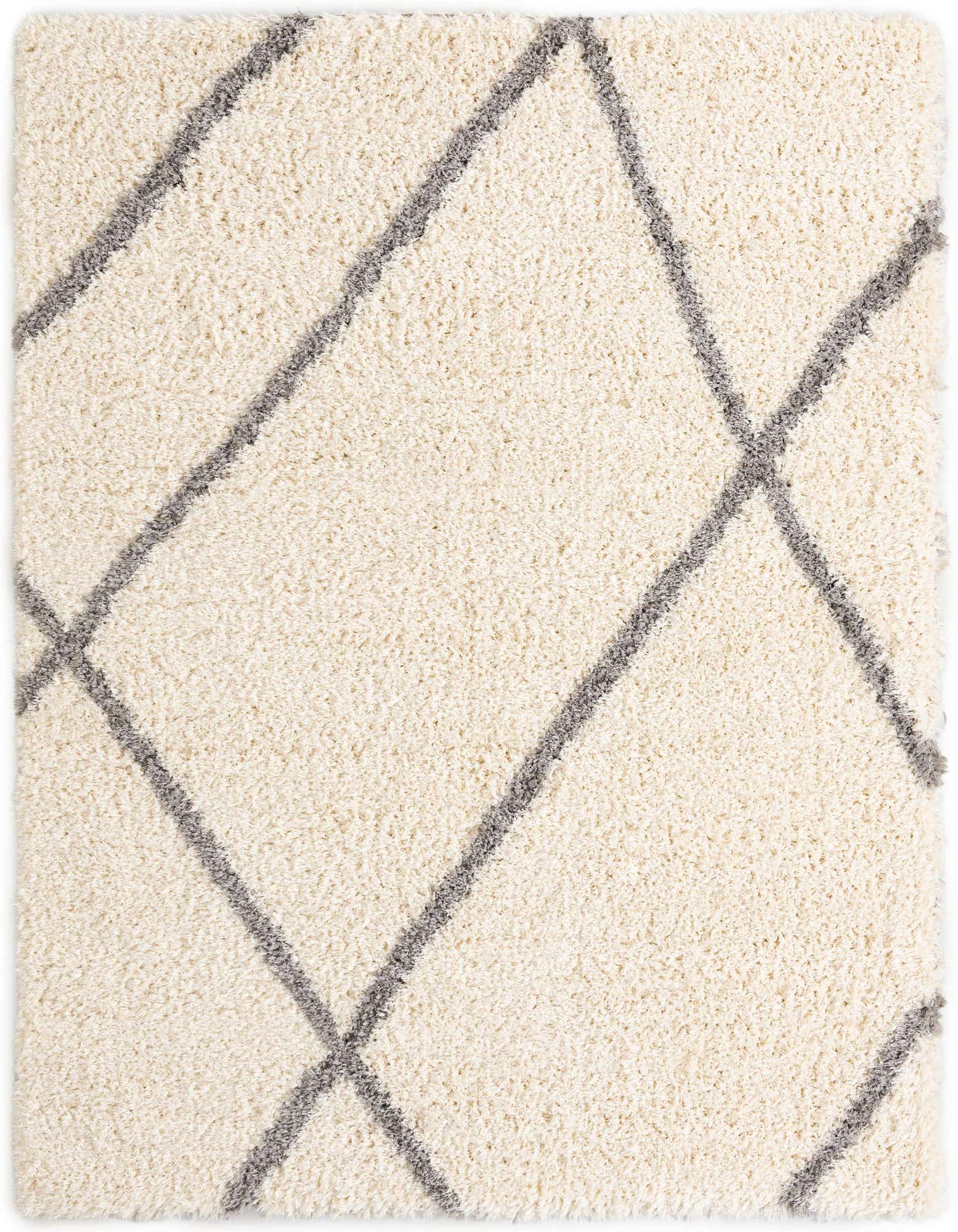 A close-up of an 8x10 rectangular Rugs.com Infinity Shag rug, featuring a soft, off-white shag pile with a modern gray geometric diamond pattern.