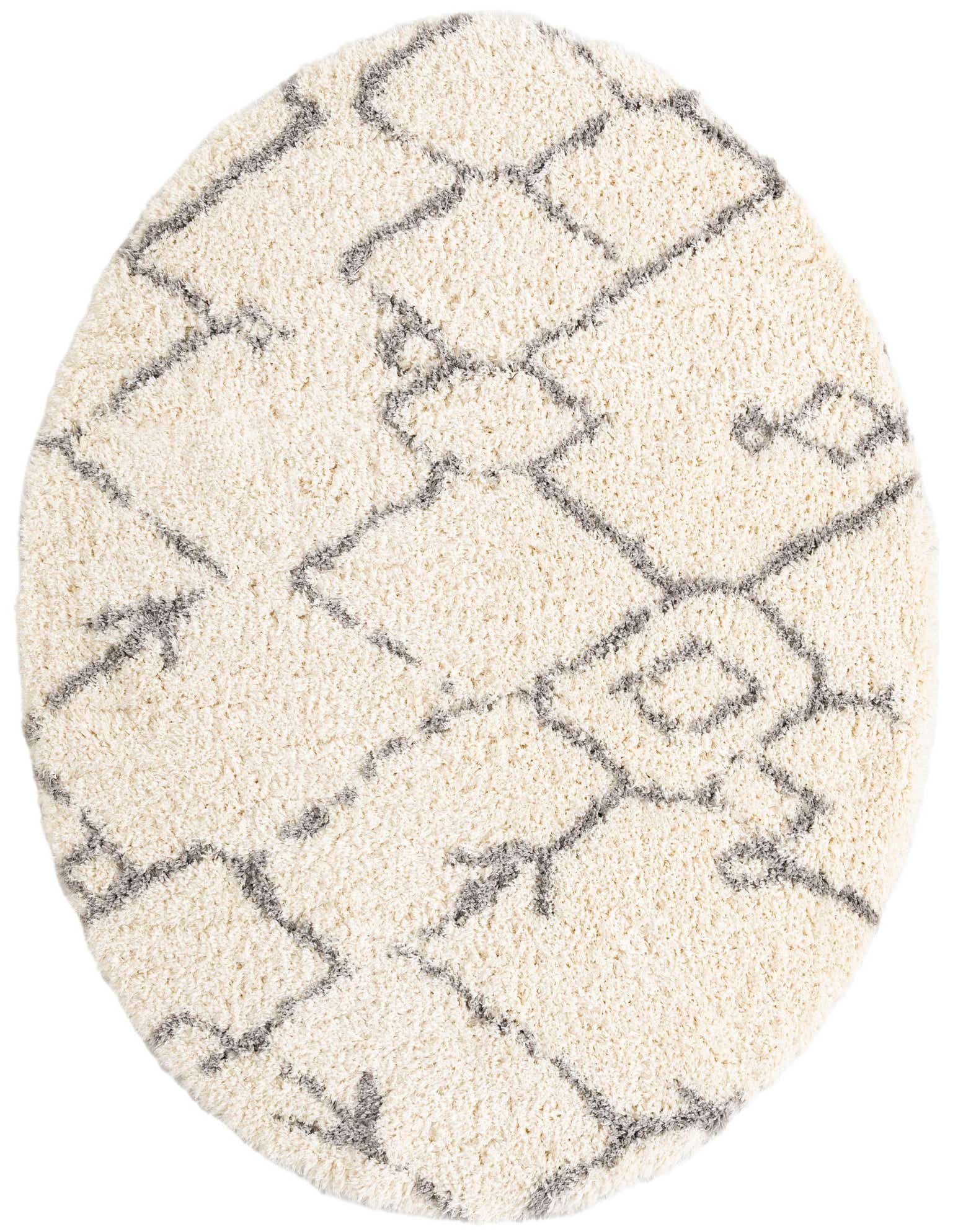 A round, cream shag rug with a modern gray geometric pattern, suitable for a living room or bedroom.