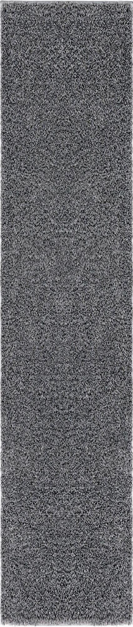 A close-up view of a rectangular gray shag runner rug, showcasing its soft, textured pile.