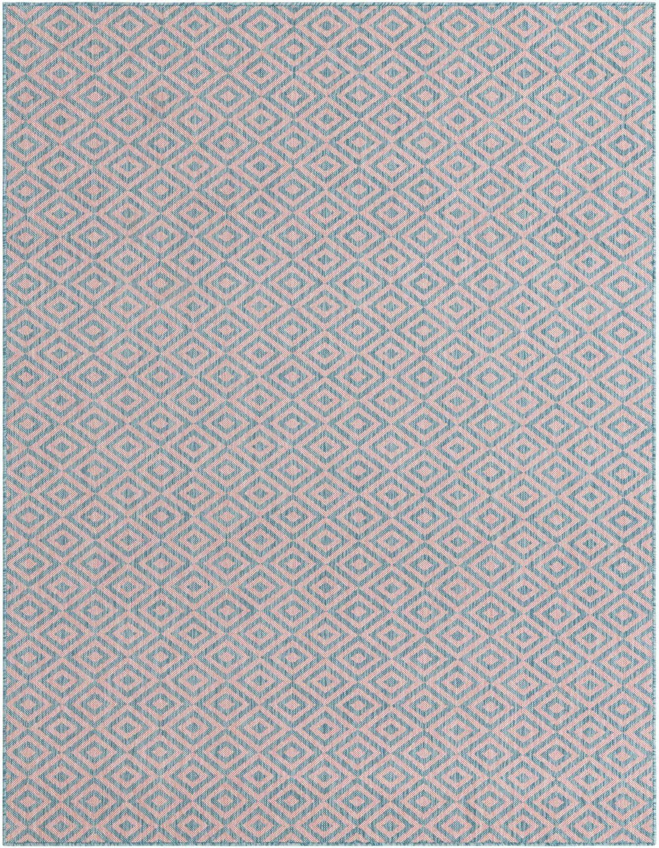 A 6x9 rectangular Jill Zarin Outdoor rug featuring a repeating pink and aqua geometric trellis pattern, suitable for indoor or outdoor use.