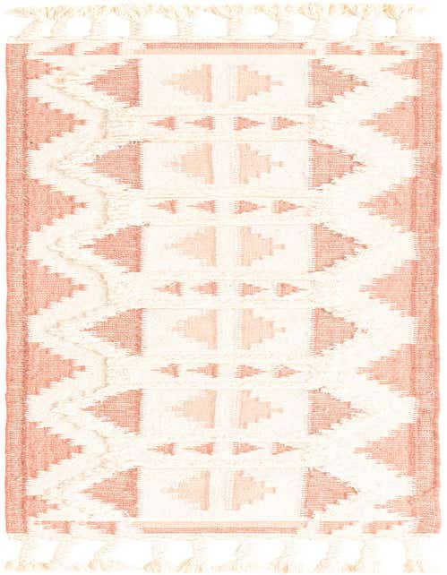 A handmade 8 ft runner rug from the Arizona collection, featuring a tribal geometric pattern in pinks and whites with shag texture and tassels.
