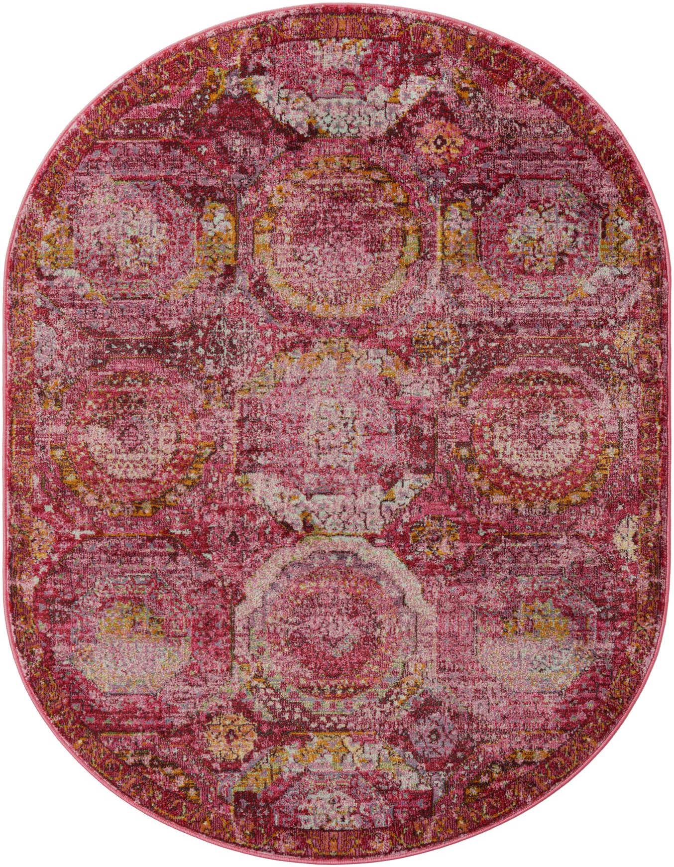 A 4' x 6' oval rug in shades of pink, featuring a distressed transitional medallion pattern with bohemian and modern influences.