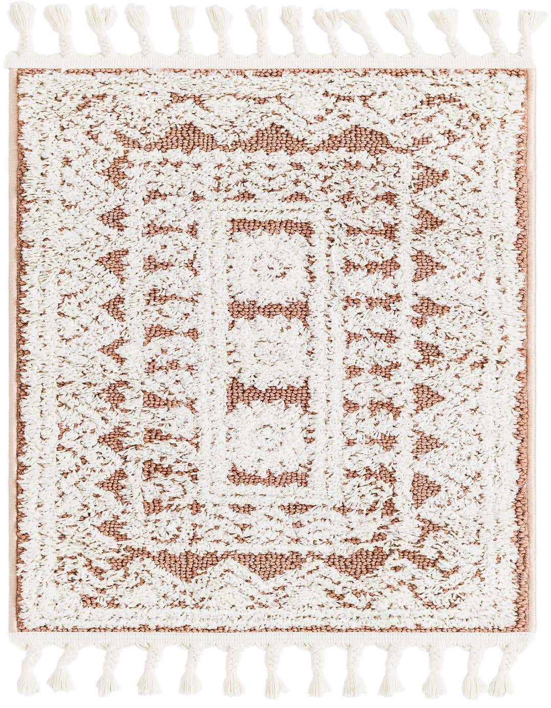 A 2x3 rectangular indoor rug with a textured pink and off-white Southwestern medallion pattern and braided tassels.