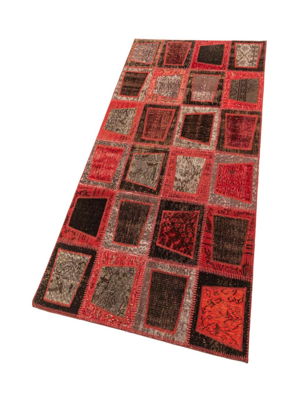 A 4x6 rectangular Rugs.com Core Patchwork rug featuring a modern design with various shades of pink and grey patches.
