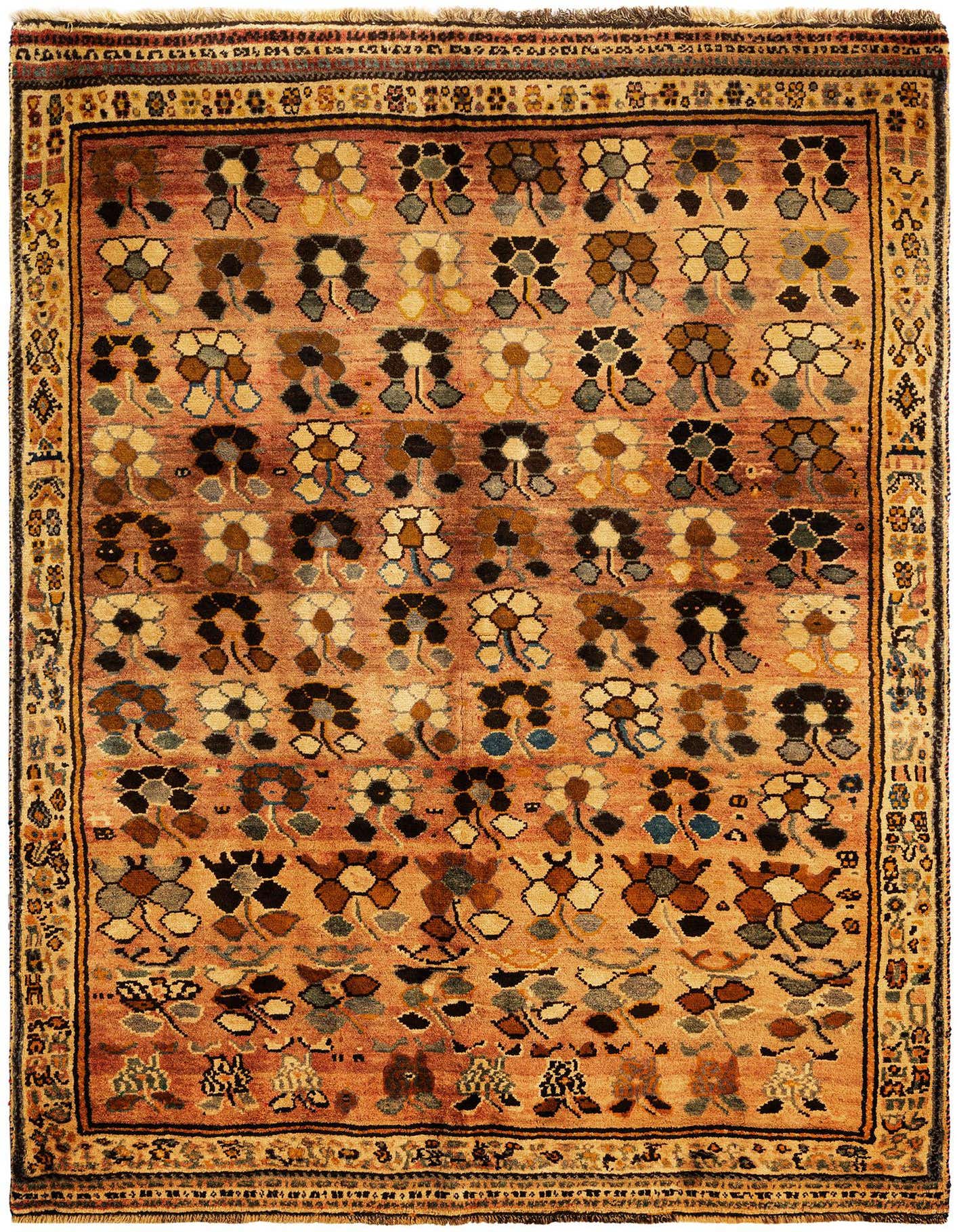 A 5x8 rectangular Gabbeh rug with a pink field featuring rows of stylized floral motifs in brown, black, cream, and blue, bordered by a traditional pattern.