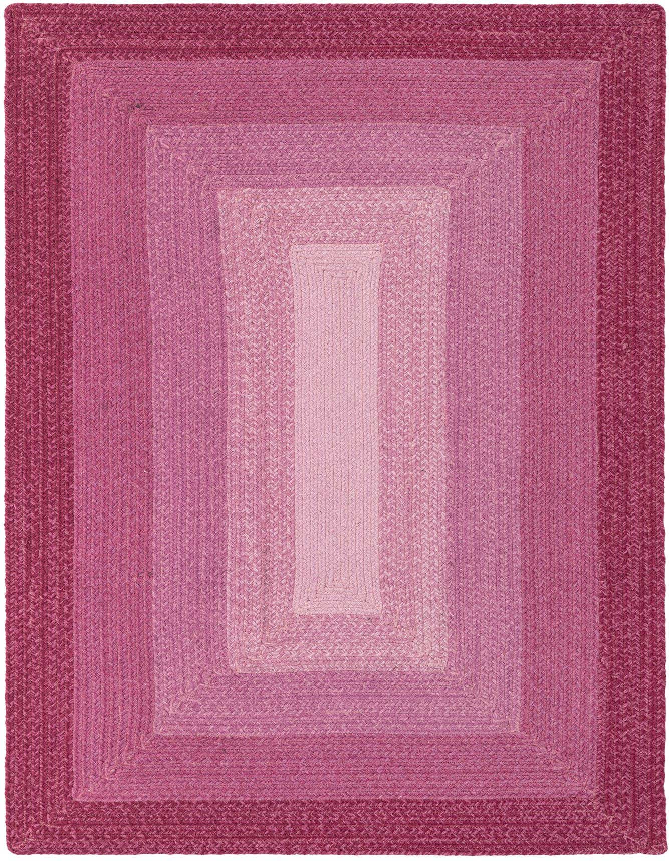 A 4x6 rectangular braided wool rug featuring a gradient of pink shades, from deep fuchsia at the edges to light blush in the center.