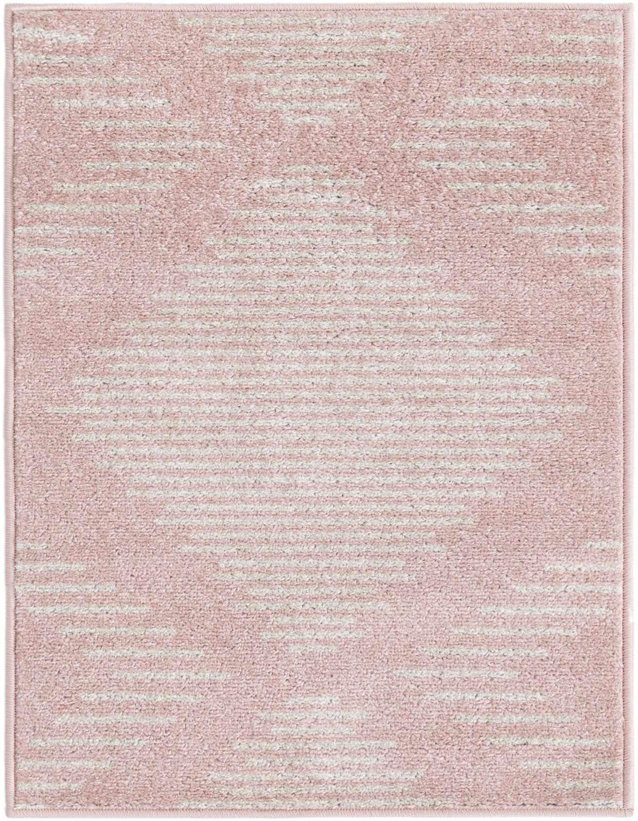 A 2x3 rectangular Kai collection rug in soft pink with a subtle, light-colored striped pattern, ideal for a modern entryway.