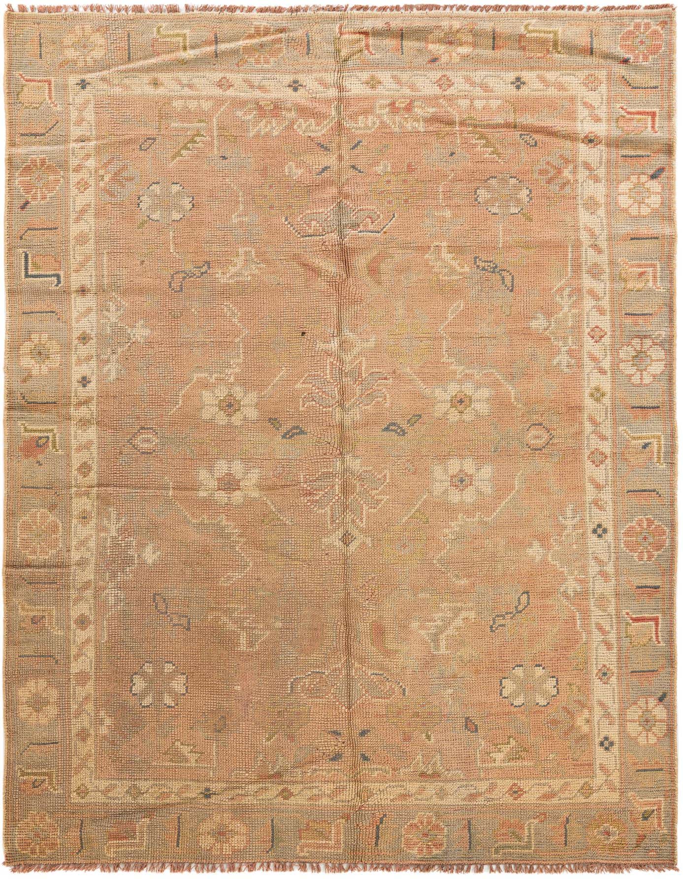 A 5x7 rectangular pink wool rug with a traditional Oriental medallion pattern and intricate floral border.
