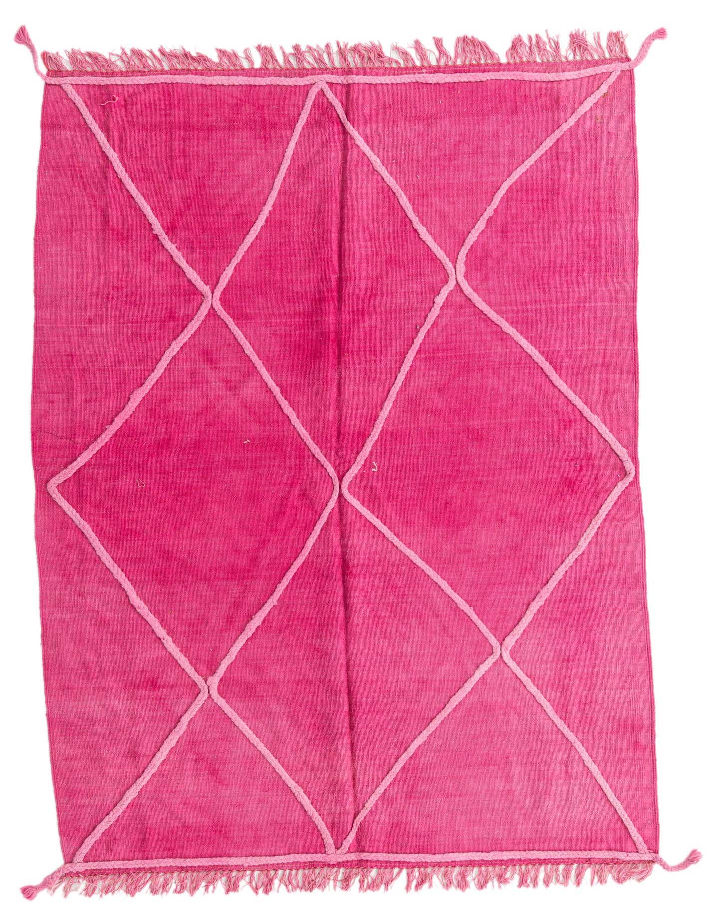 A 4x6 rectangular pink wool flatweave rug with a light pink diamond tribal pattern and fringed edges.