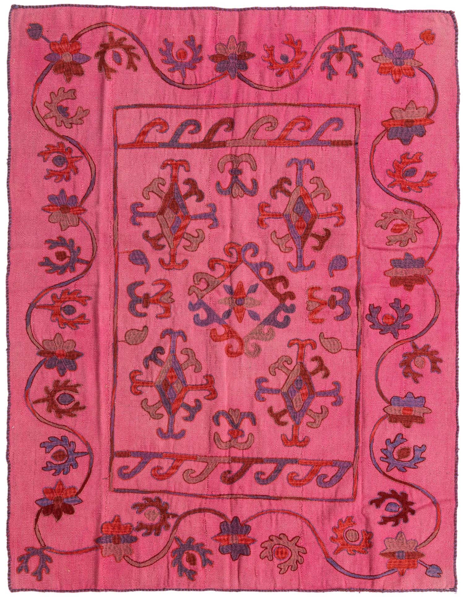 A 5x8 rectangular Kilim Suzani rug featuring a vibrant pink background with intricate tribal and floral patterns in red, purple, and brown.