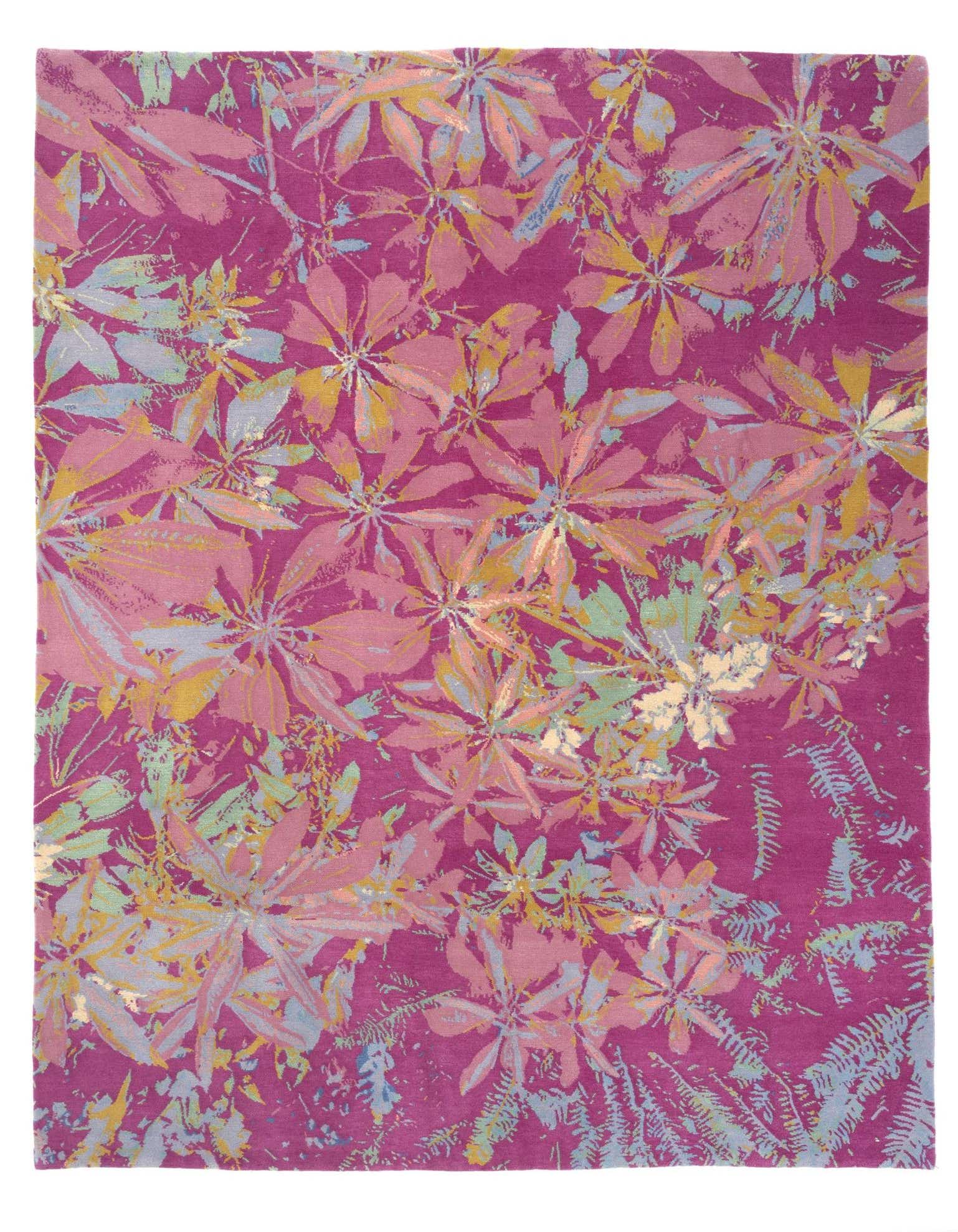 A vibrant 8x10 rectangular pink wool rug featuring an abstract modern floral and leaf pattern in shades of light pink, yellow, and blue.