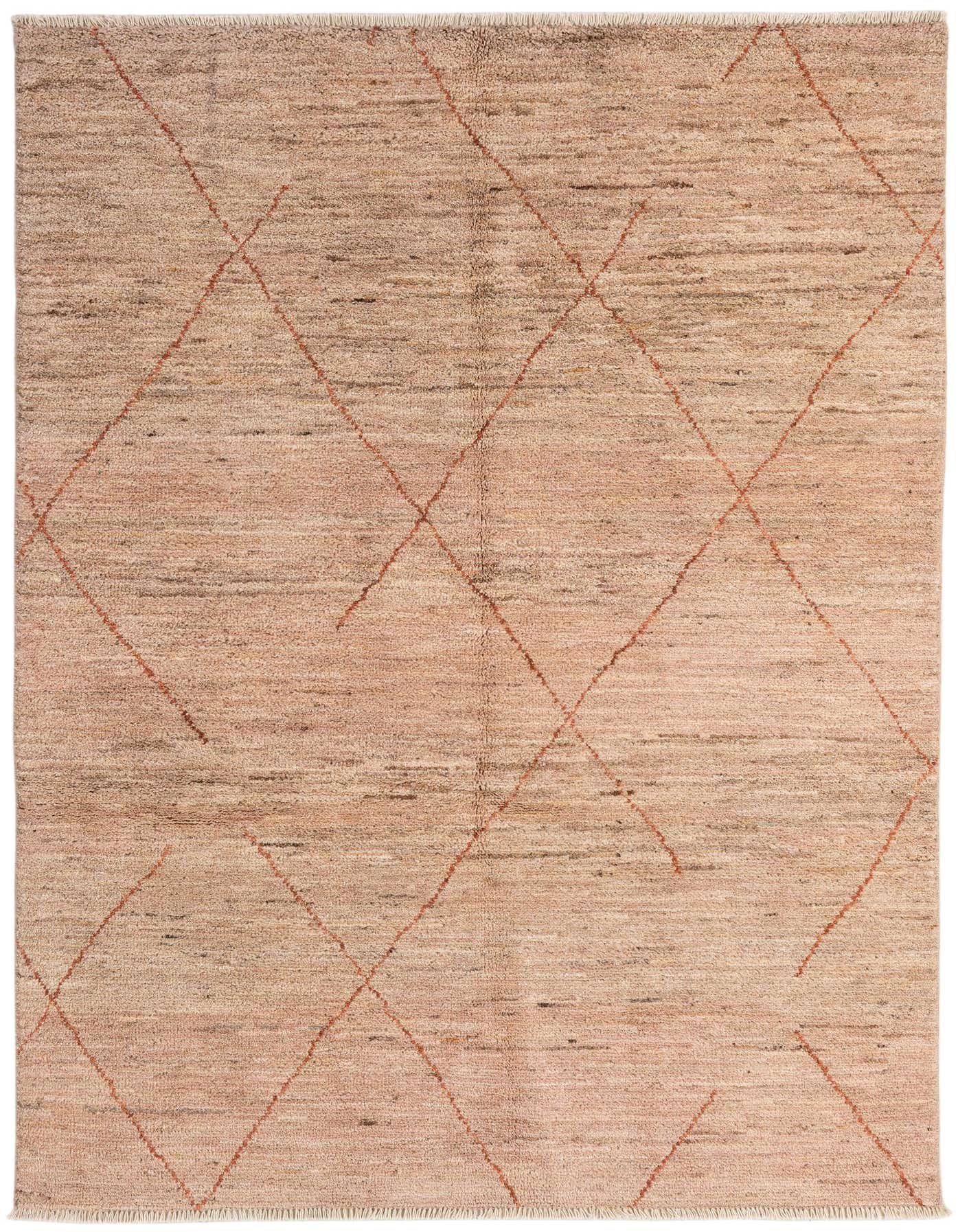 A 4x6 rectangular pink shag rug with a subtle tribal diamond pattern in a living room setting.