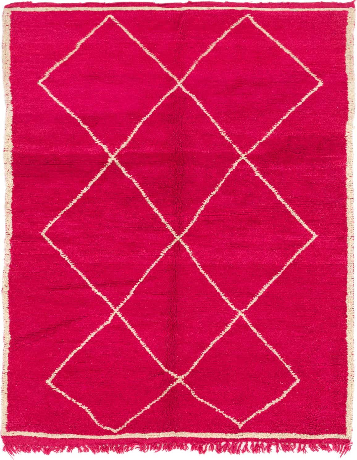 A vibrant 5x8 rectangular pink shag rug with a white tribal diamond pattern, ideal for a living room.