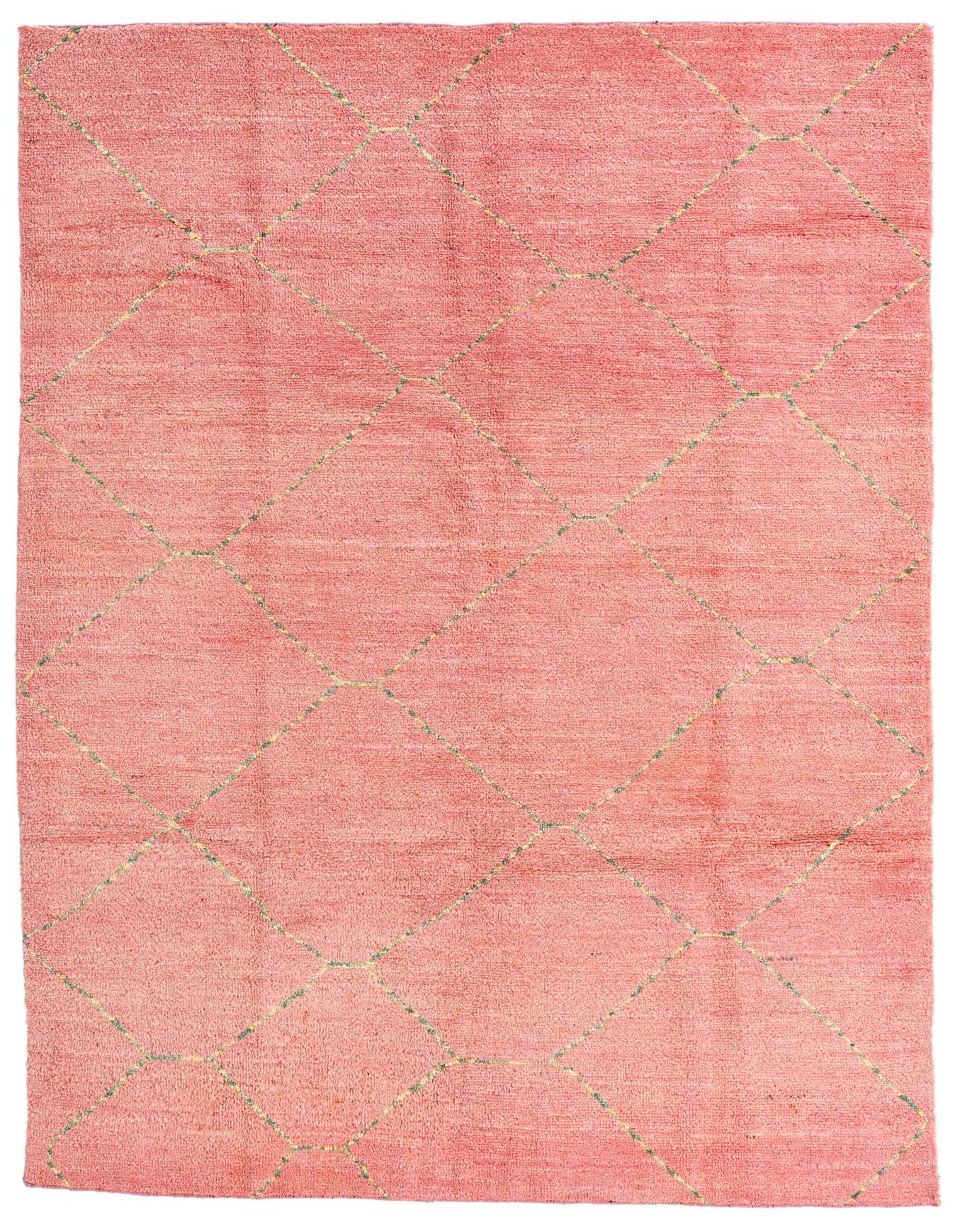 A 6x9 rectangular pink shag rug with a subtle tribal diamond pattern in lighter pink and green.