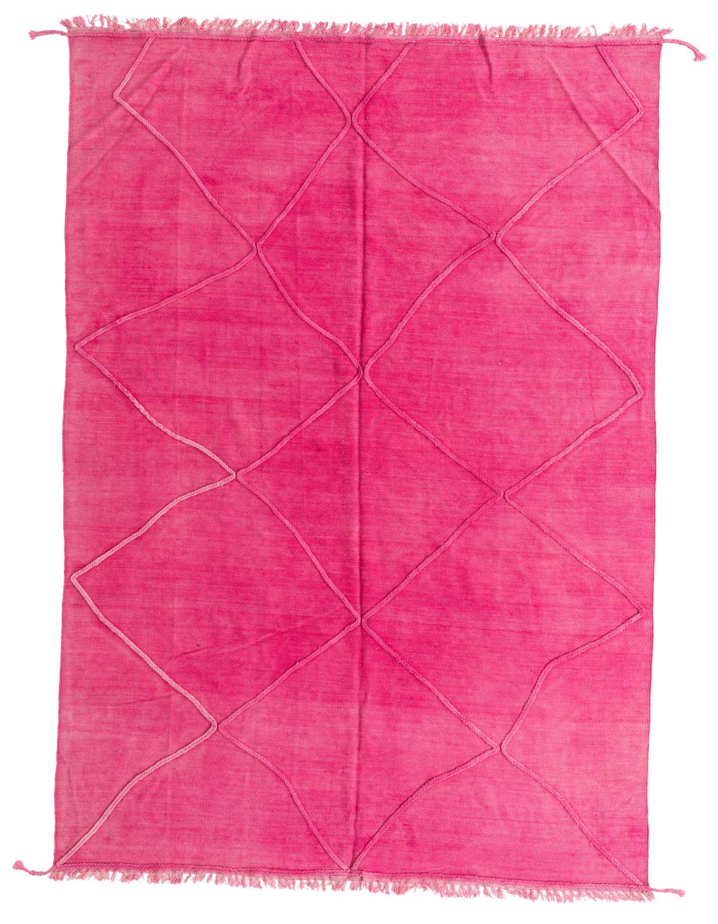 A 6x9 rectangular pink shag rug with a raised tribal diamond pattern and fringed edges, suitable for a living room.