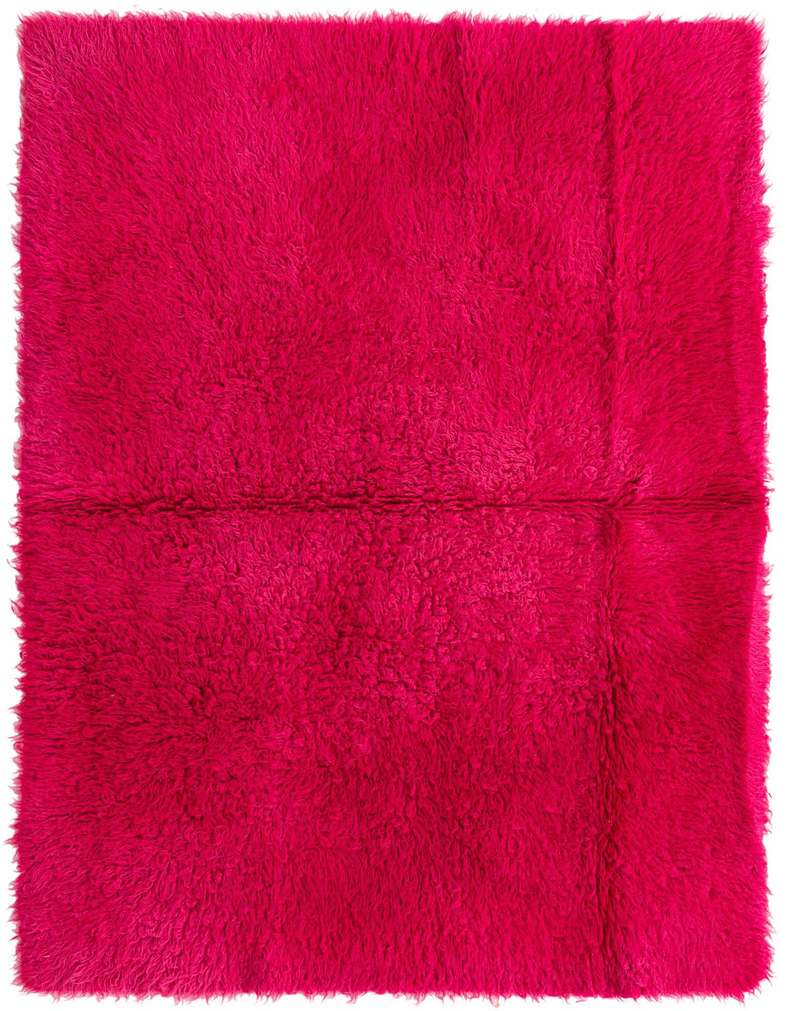 A vibrant 4x6 rectangular pink shag rug, handmade from wool, featuring a plush, textured pile.