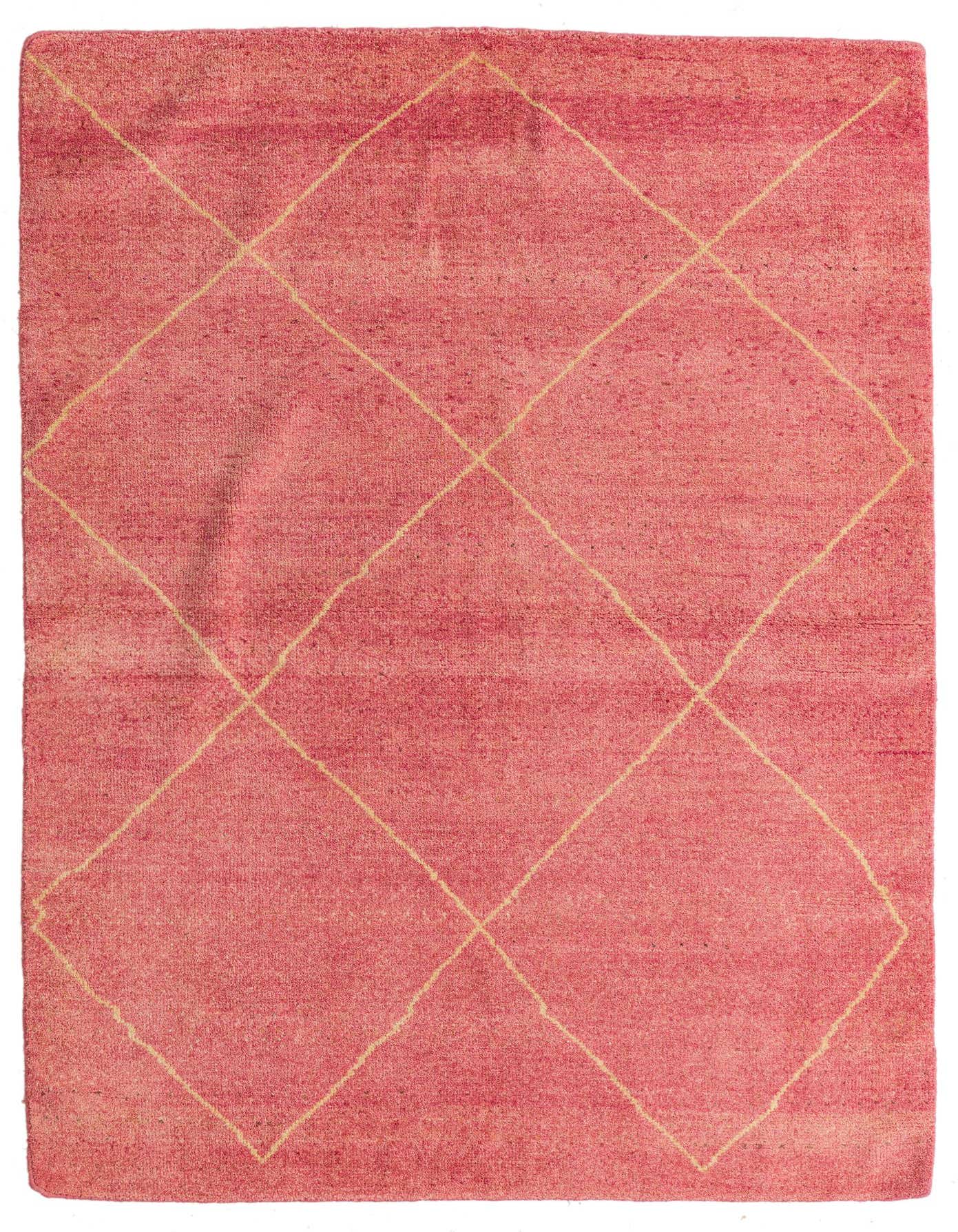 A 4x6 rectangular pink shag rug with a cream diamond pattern, suitable for a living room or bedroom.