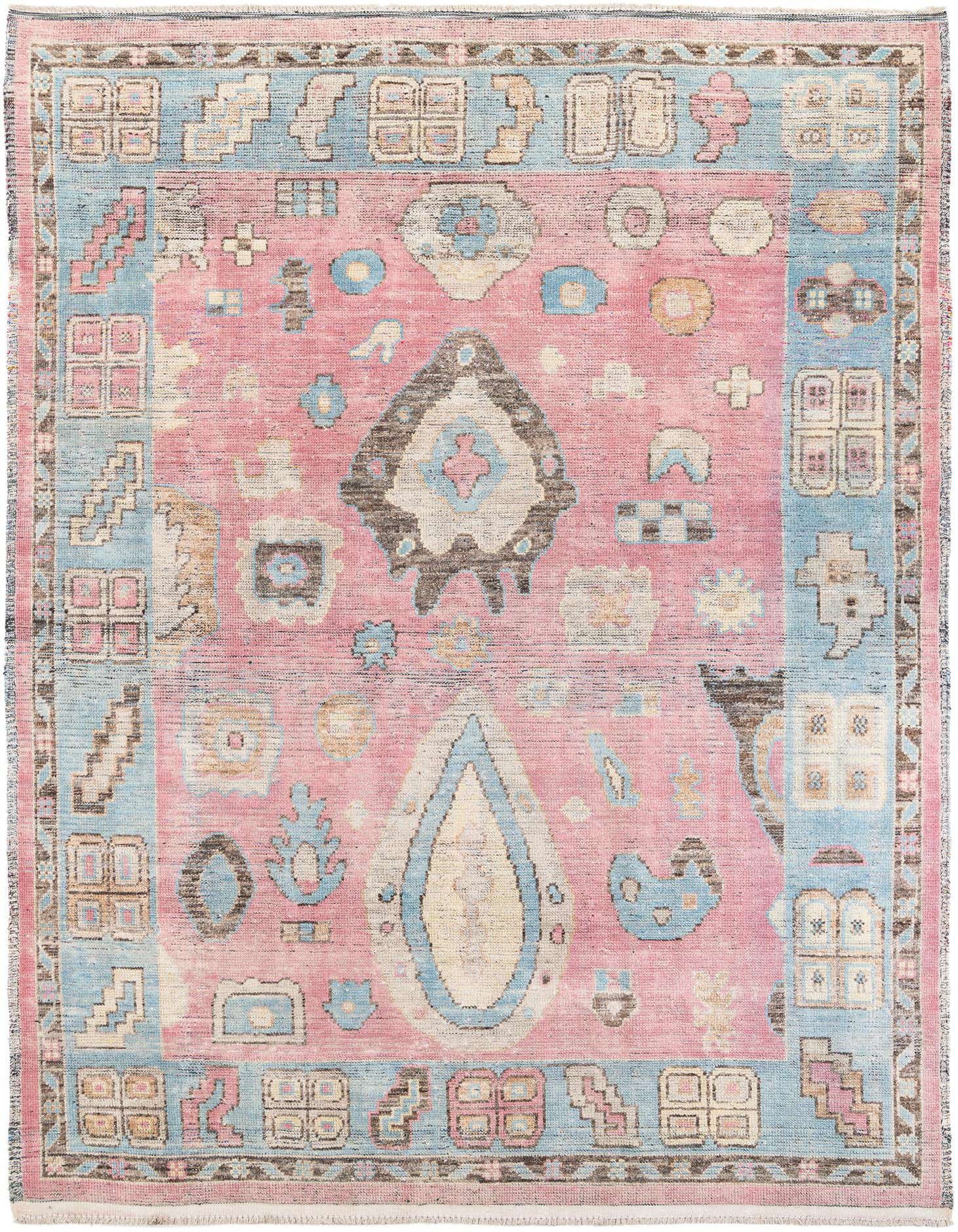 A 9x12 rectangular pink and blue tribal wool rug with a shag pile, featuring an intricate geometric pattern.