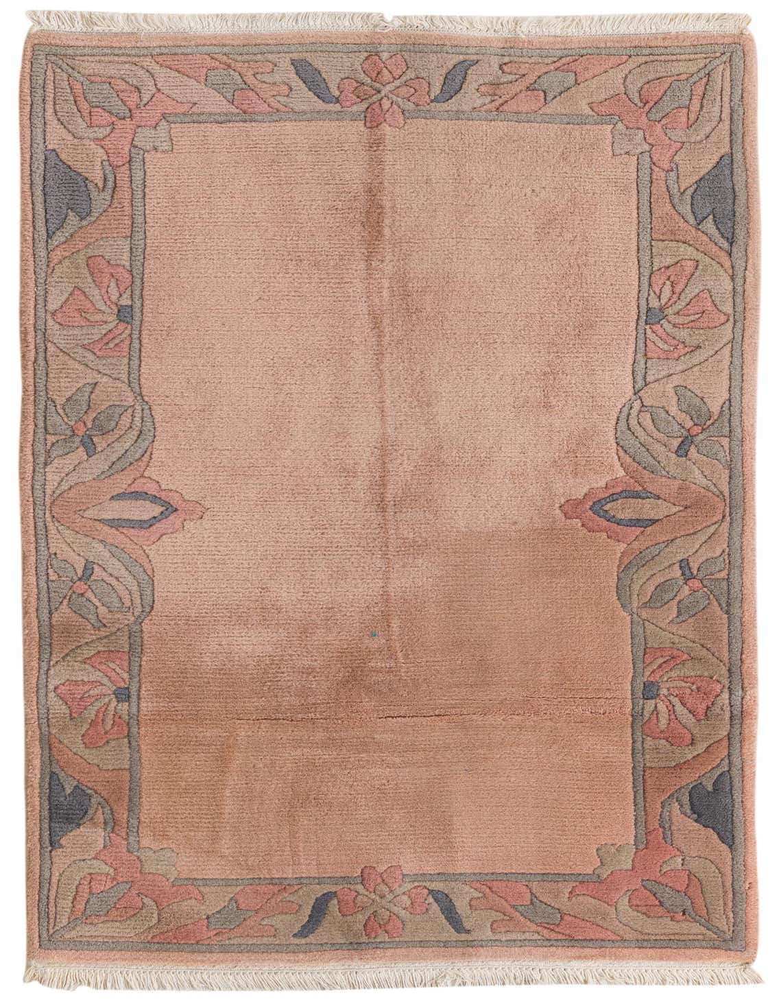 A 3x5 rectangular pink wool rug with a high pile and an abstract floral border in muted pink, blue, and beige.
