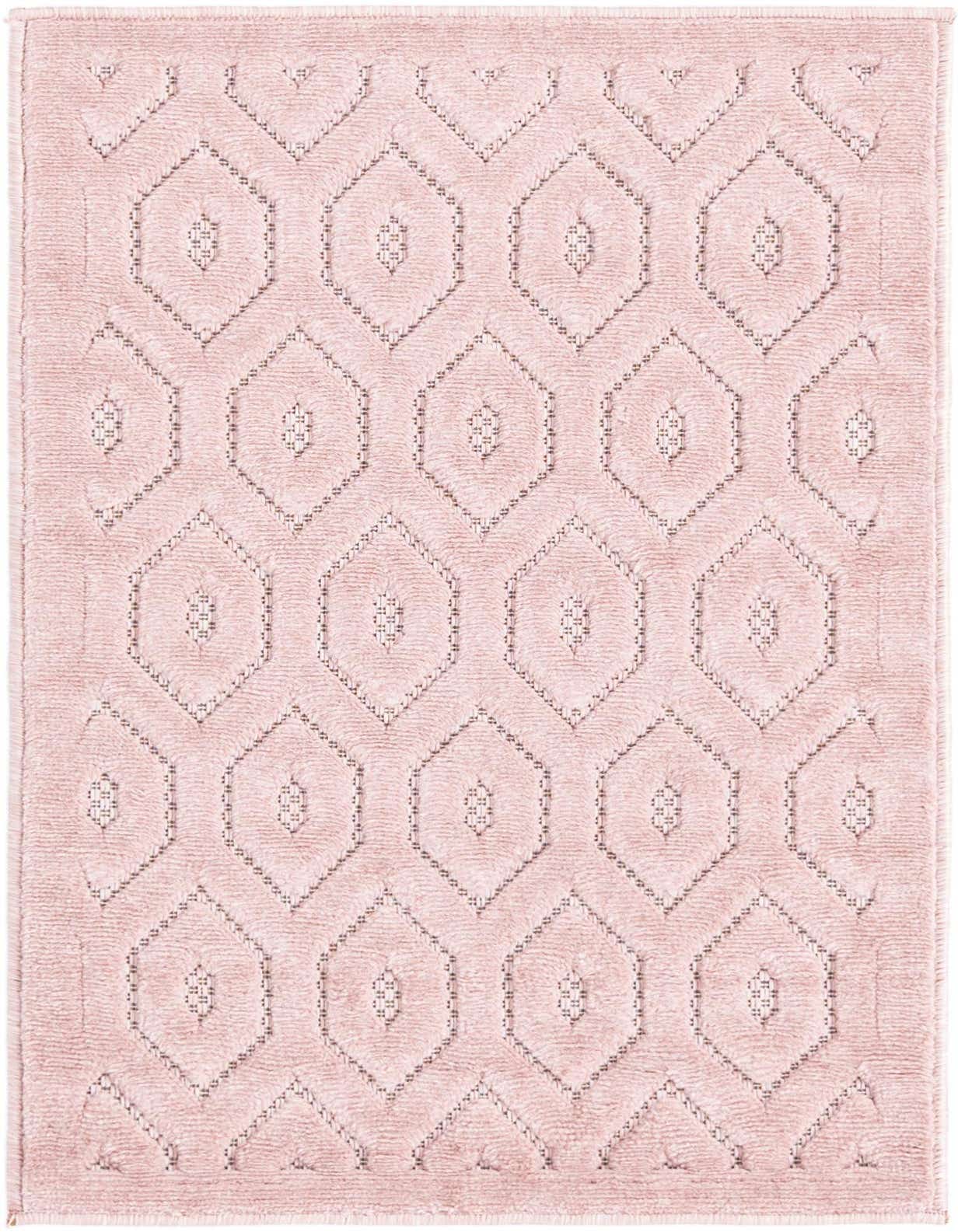 A 2x3 rectangular pink polypropylene rug featuring a textured tribal trellis pattern with raised hexagons, suitable for indoor or outdoor use.