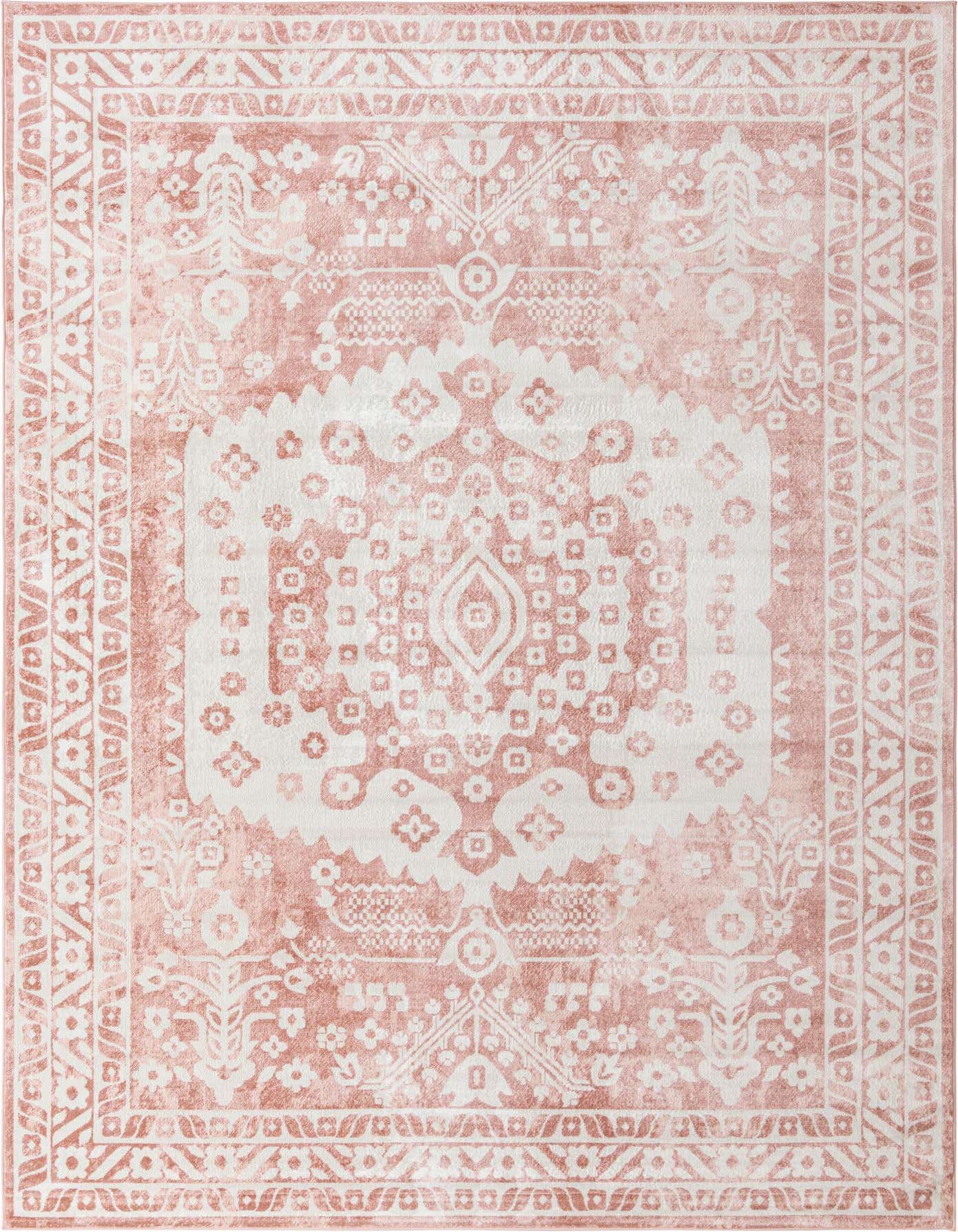 A 10x14 rectangular pink and white bohemian rug with a distressed medallion pattern and botanical accents.