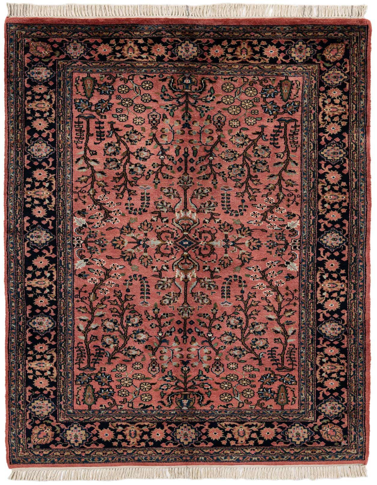 A 5x7 rectangular Sarough rug featuring a traditional floral pattern in various shades of pink and navy blue, with fringed ends.