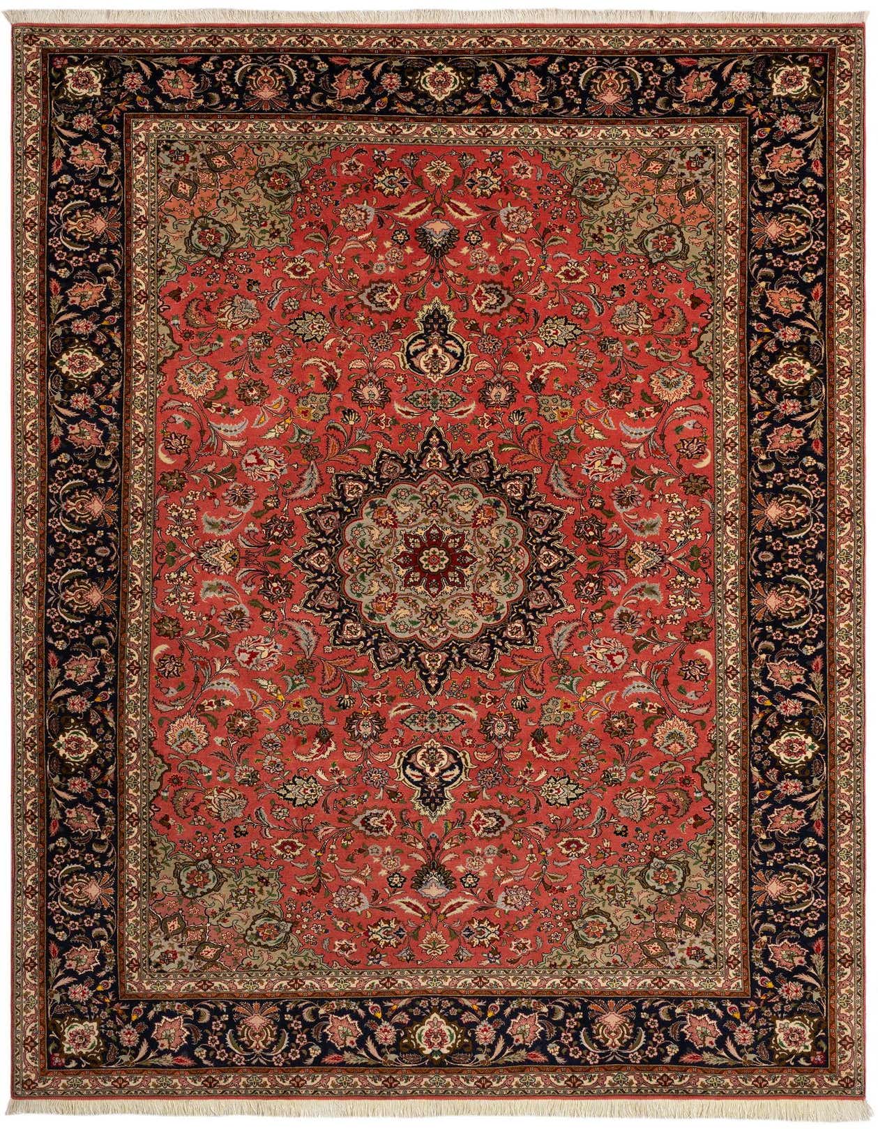 A 7x10 rectangular Persian Tabriz rug with a detailed floral medallion on a pink field, bordered by dark blue.