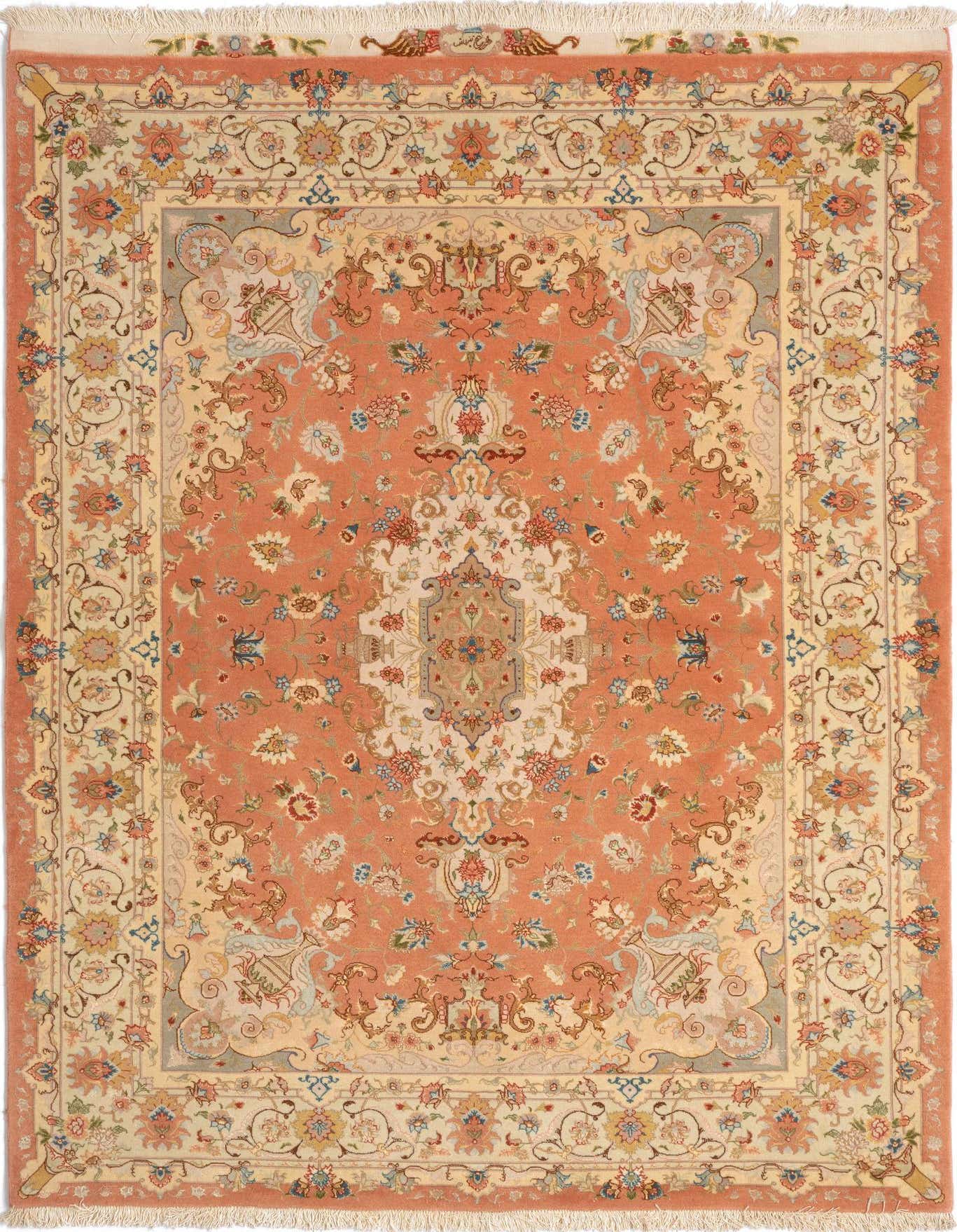 A 5x8 rectangular handmade Persian rug in shades of pink, peach, and cream with intricate floral and medallion patterns, ideal for a living room.