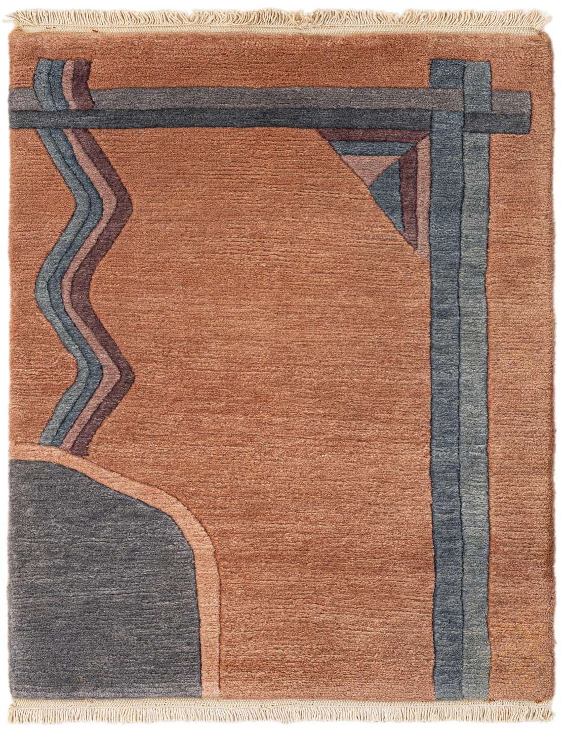 2x3 rectangular wool rug in pink with modern blue and brown abstract geometric patterns, featuring fringe.