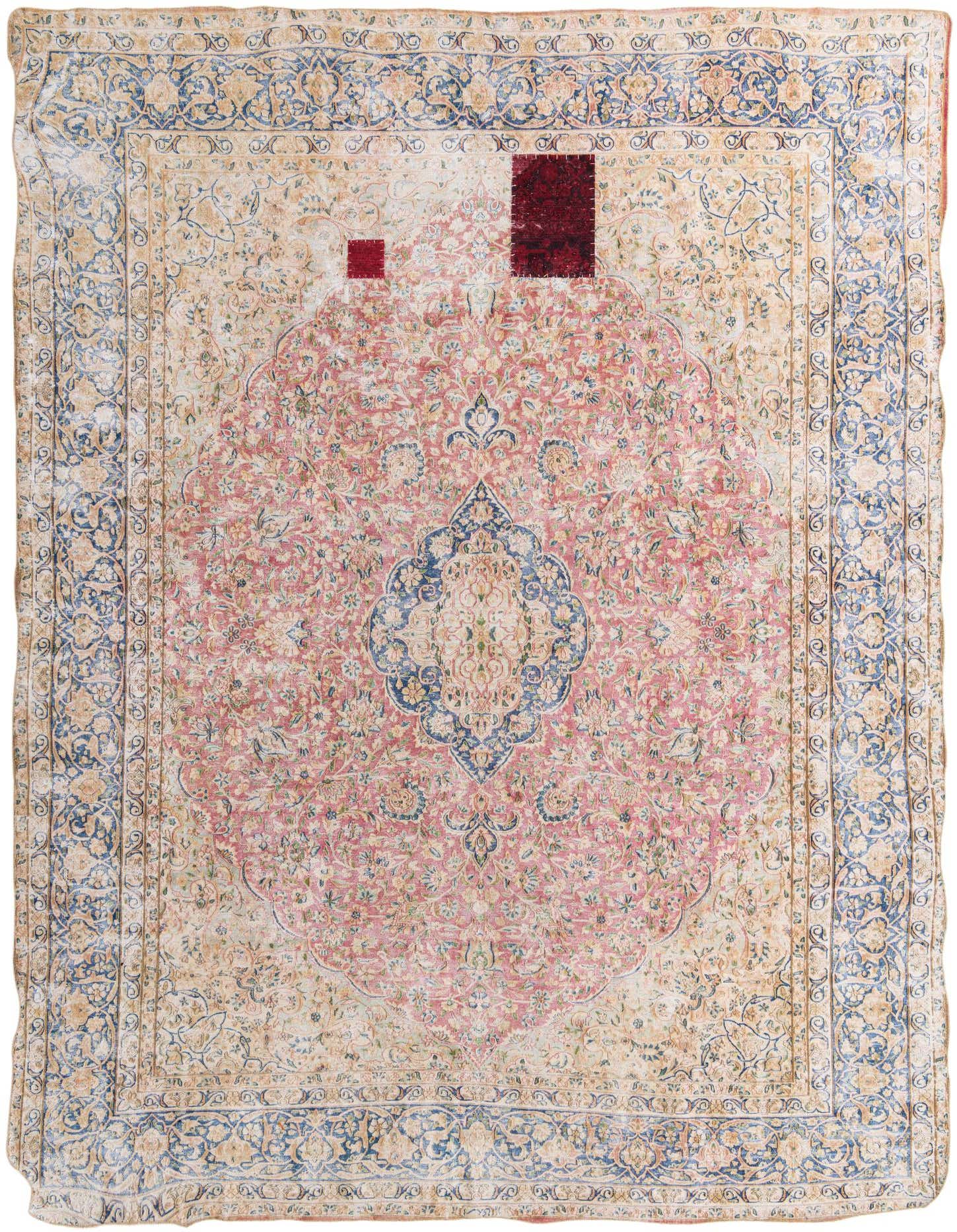 A large 10x13 rectangular Persian rug with a pink medallion center and intricate floral patterns in pinks, blues, and creams.