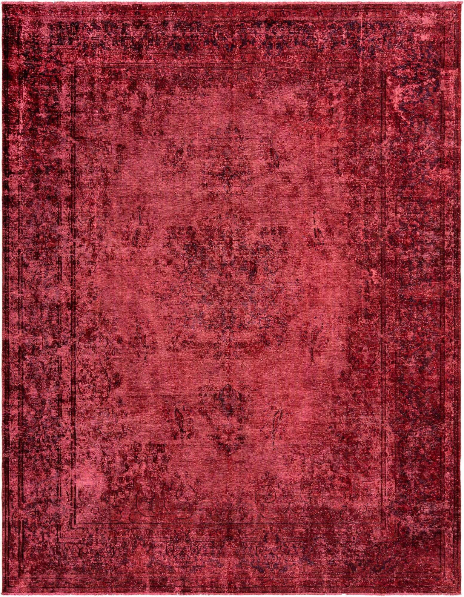 A 10x13 rectangular pink Persian rug with a distressed vintage pattern and a subtle border, ideal for a living room.